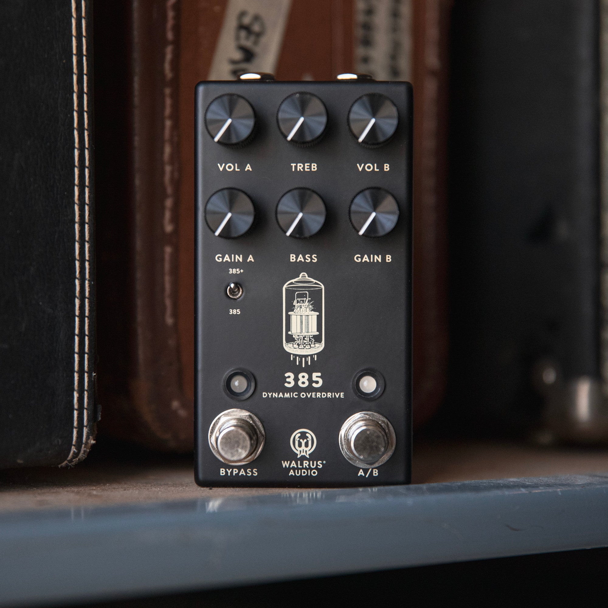A black guitar effects pedal with silver knobs and labels.