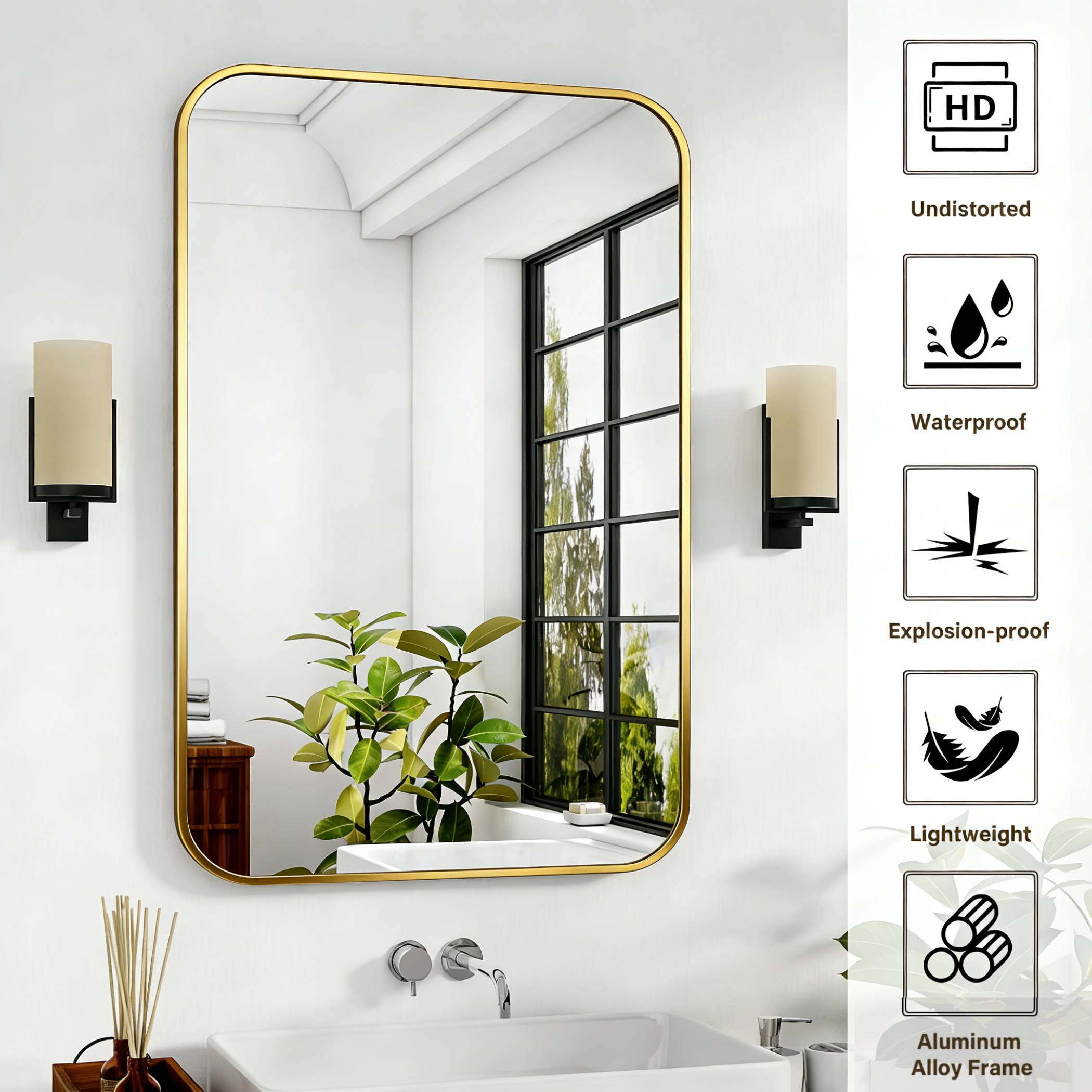 Ein rechteckiger Spiegel mit goldenem Rahmen hängt über einem Waschbecken.