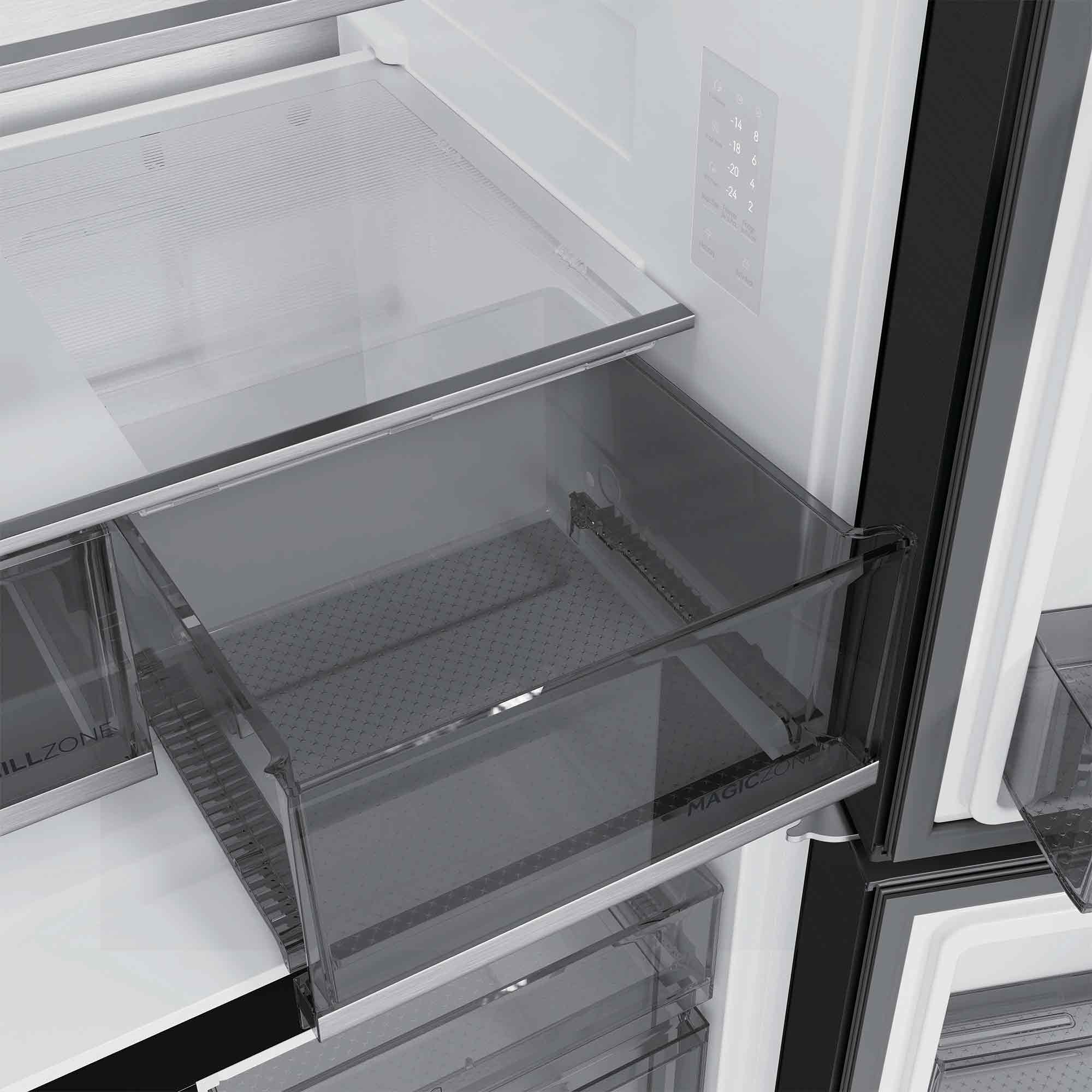 Un cajón de refrigerador abierto con cubierta de vidrio y controles de temperatura en la pared.