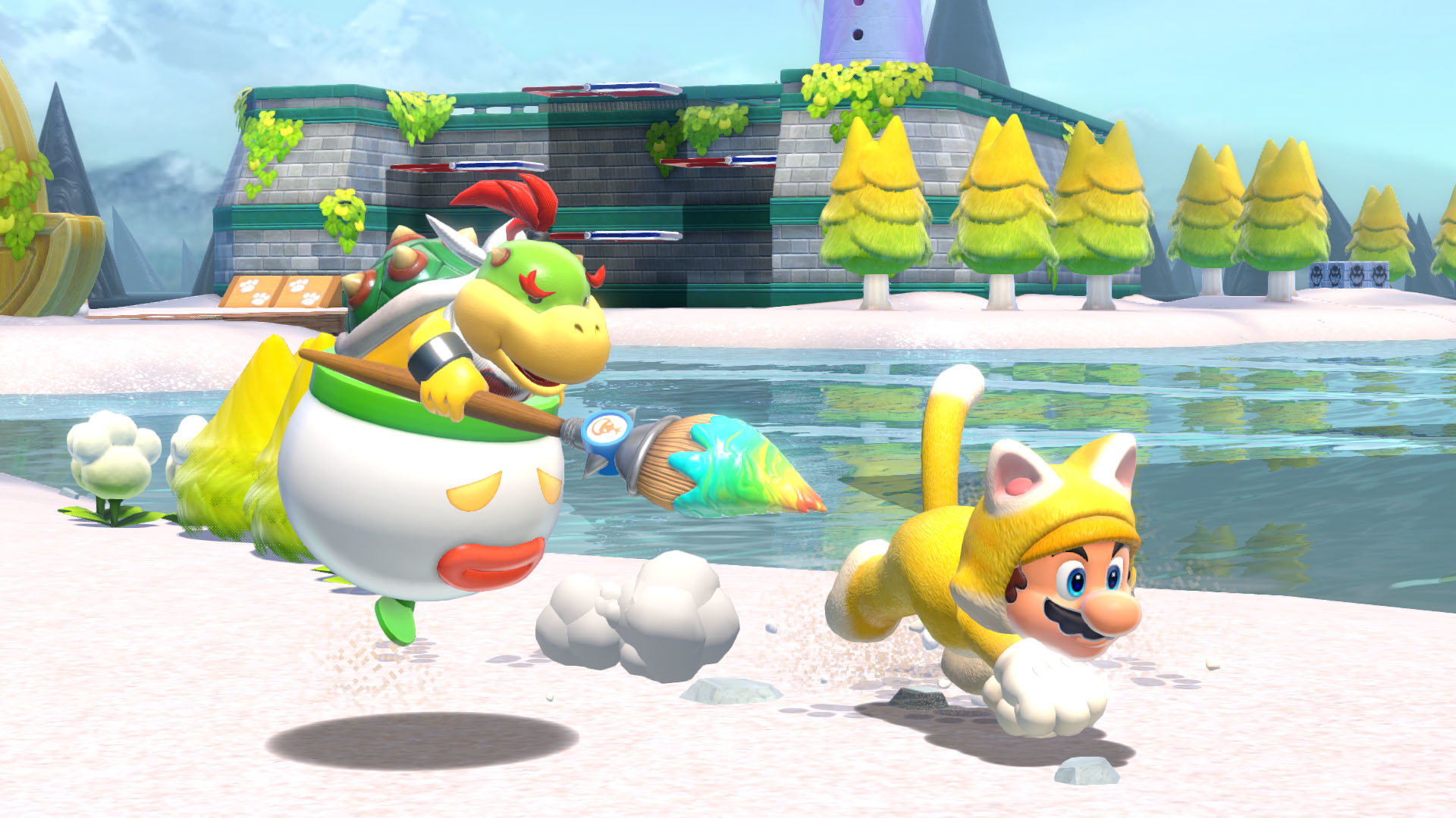 Bowser Jr. mit einem Pinsel jagt Katzen-Mario über einen Strand.