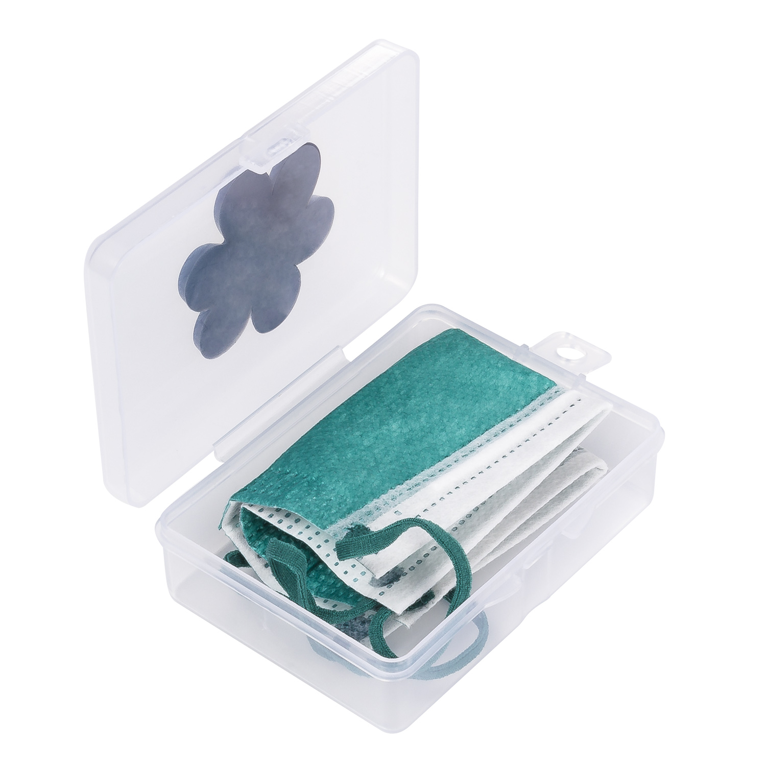 Caja transparente con mascarillas dentro y diseño de trébol en la tapa.