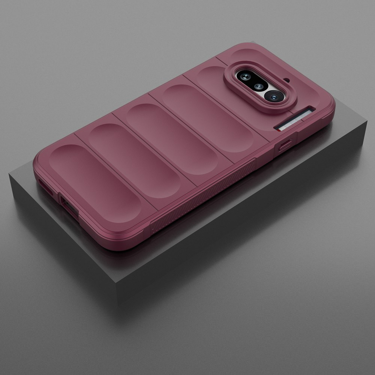 Een bordeauxrode telefoonhoes met ribbelpatroon en cameralens.