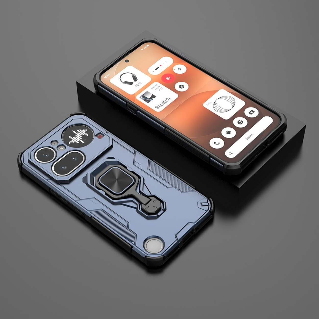 Un téléphone bleu avec support est à côté d'un téléphone noir sur une surface sombre.