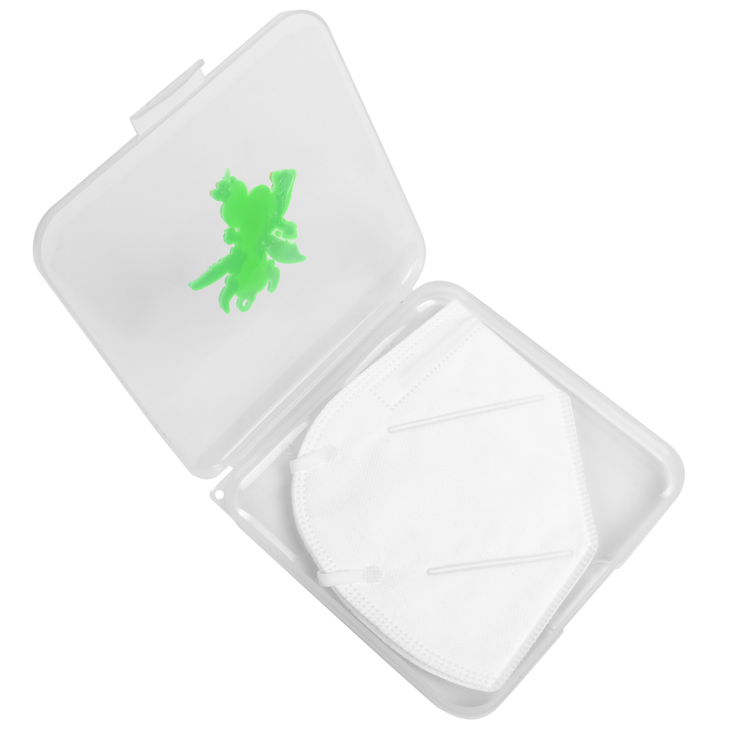 Una mascarilla blanca dentro de un estuche transparente con una figura verde en la tapa.