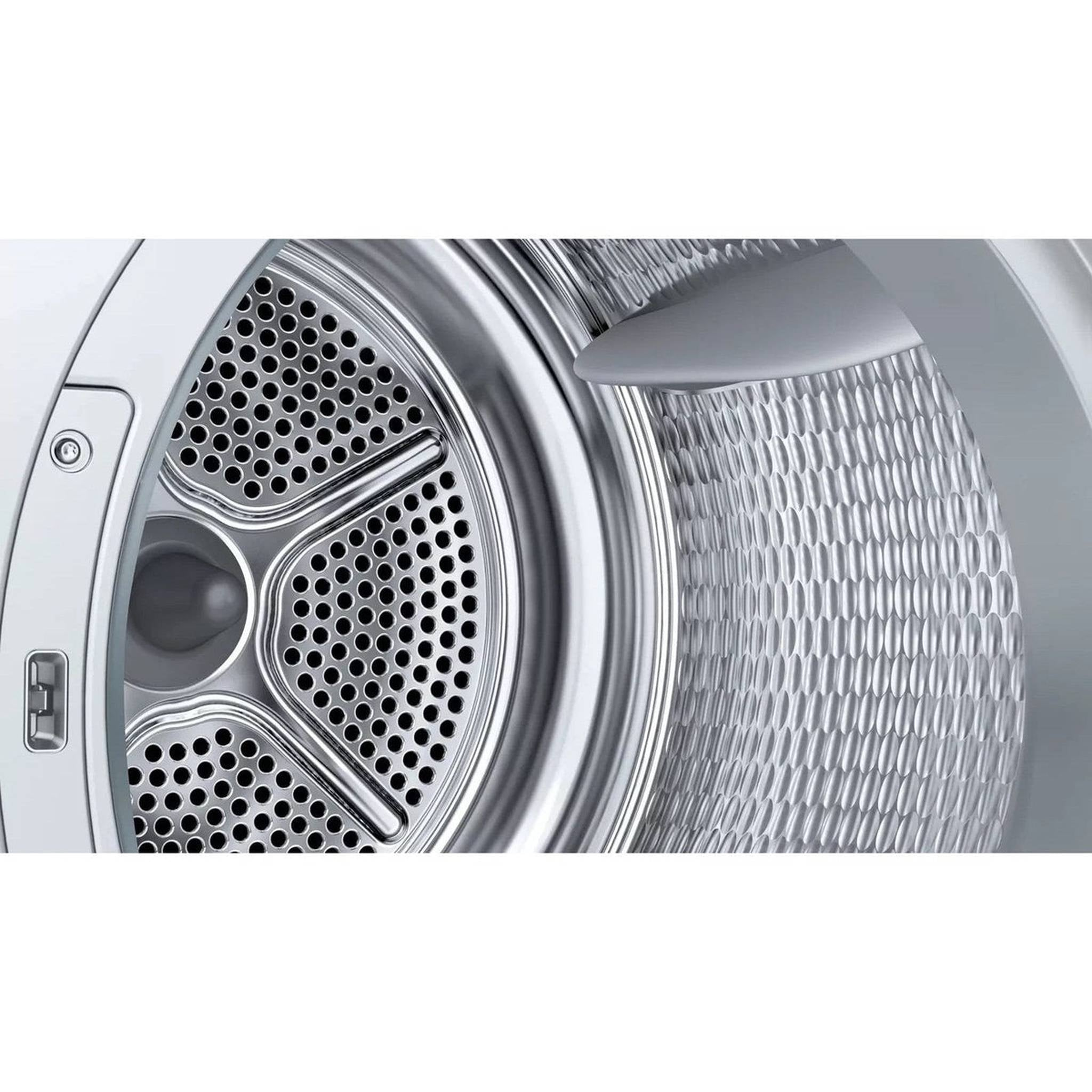 Close-up of a dryer drum with perforated pattern and a honeycomb texture.