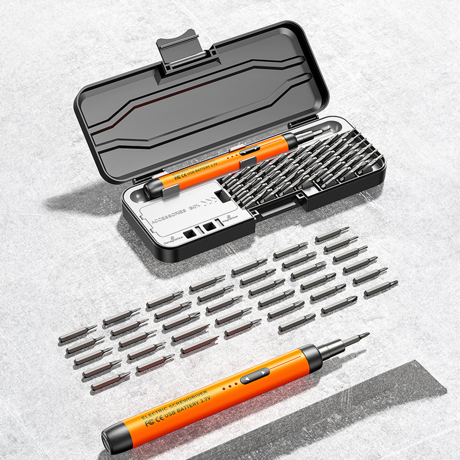 Un destornillador eléctrico naranja con muchos puntas, mostrado con su estuche.