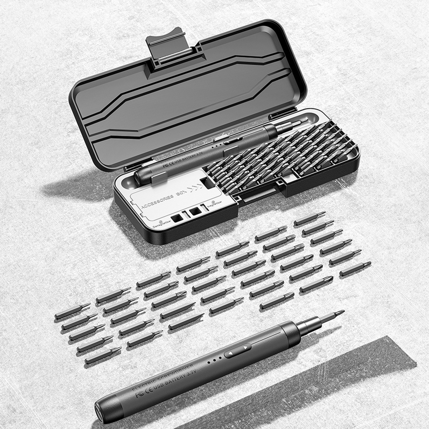 Un destornillador eléctrico con puntas extendidas y en un estuche negro abierto.