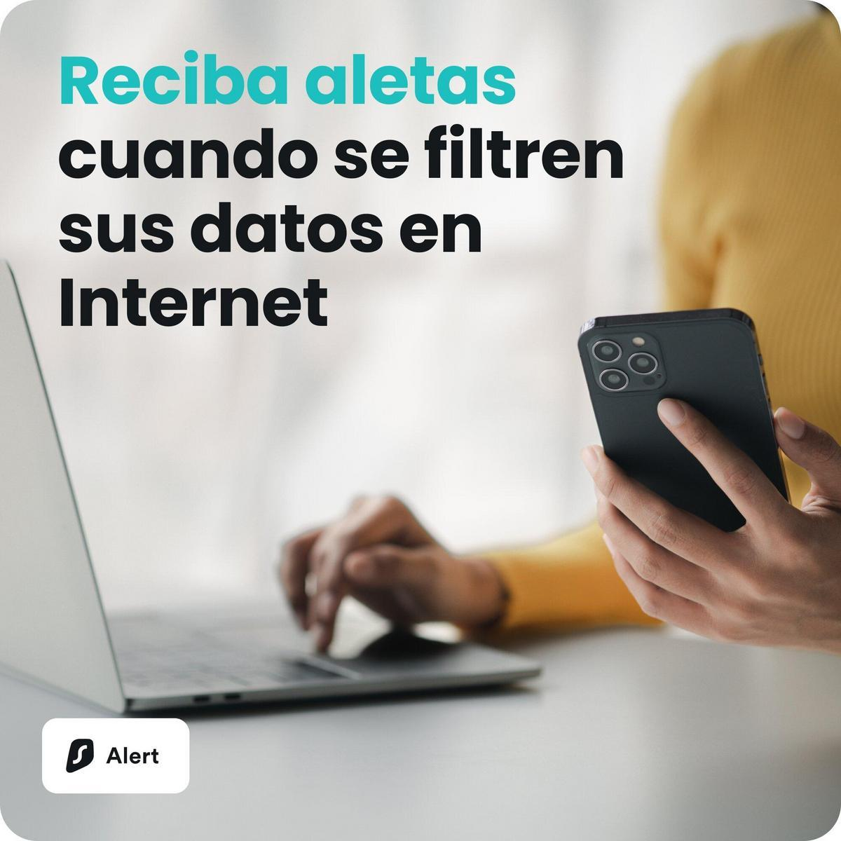Persona escribiendo en portátil, sosteniendo smartphone. Texto: Recibe alertas.
