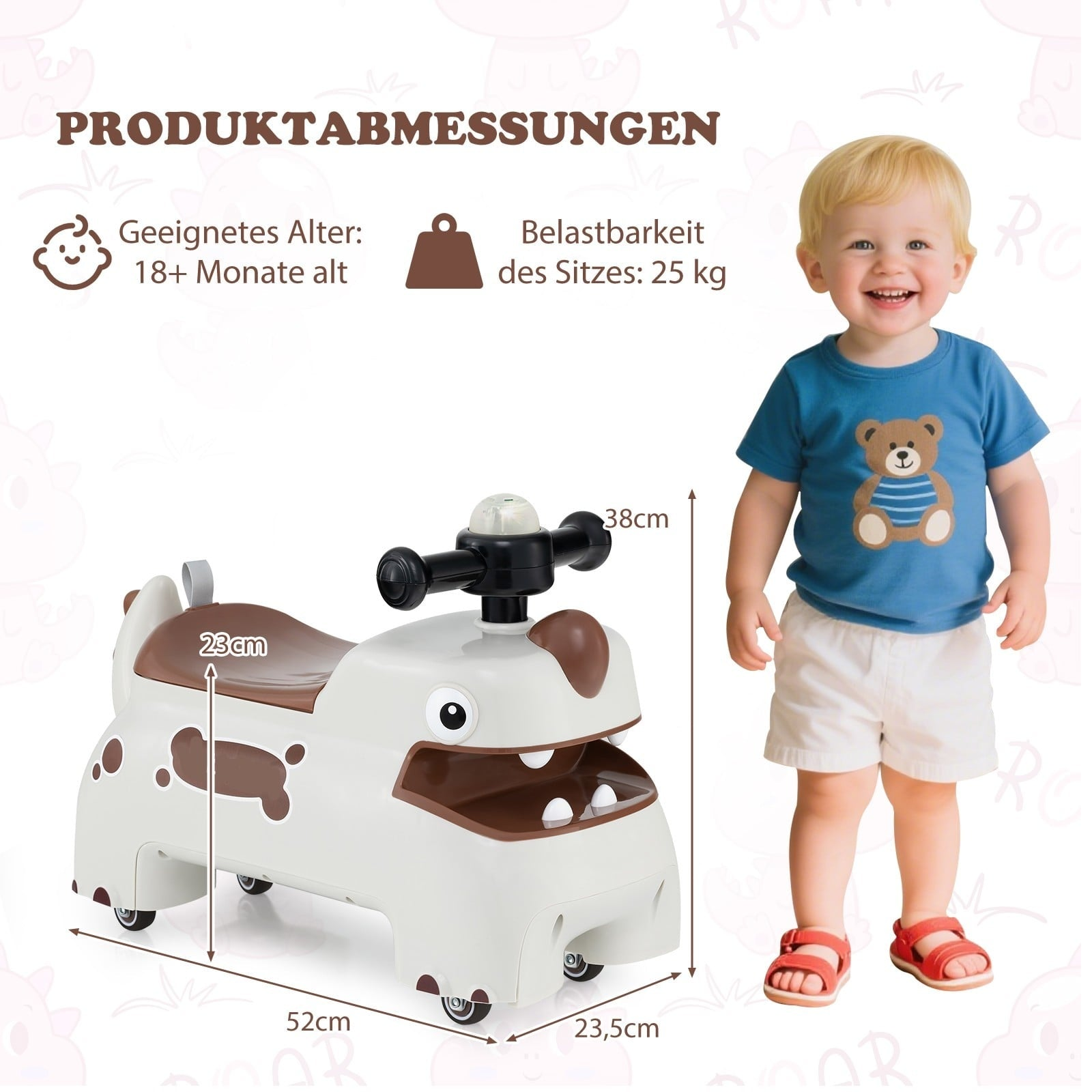 A smiling toddler stands next to a beige toy car shaped like a dog with brown spots.