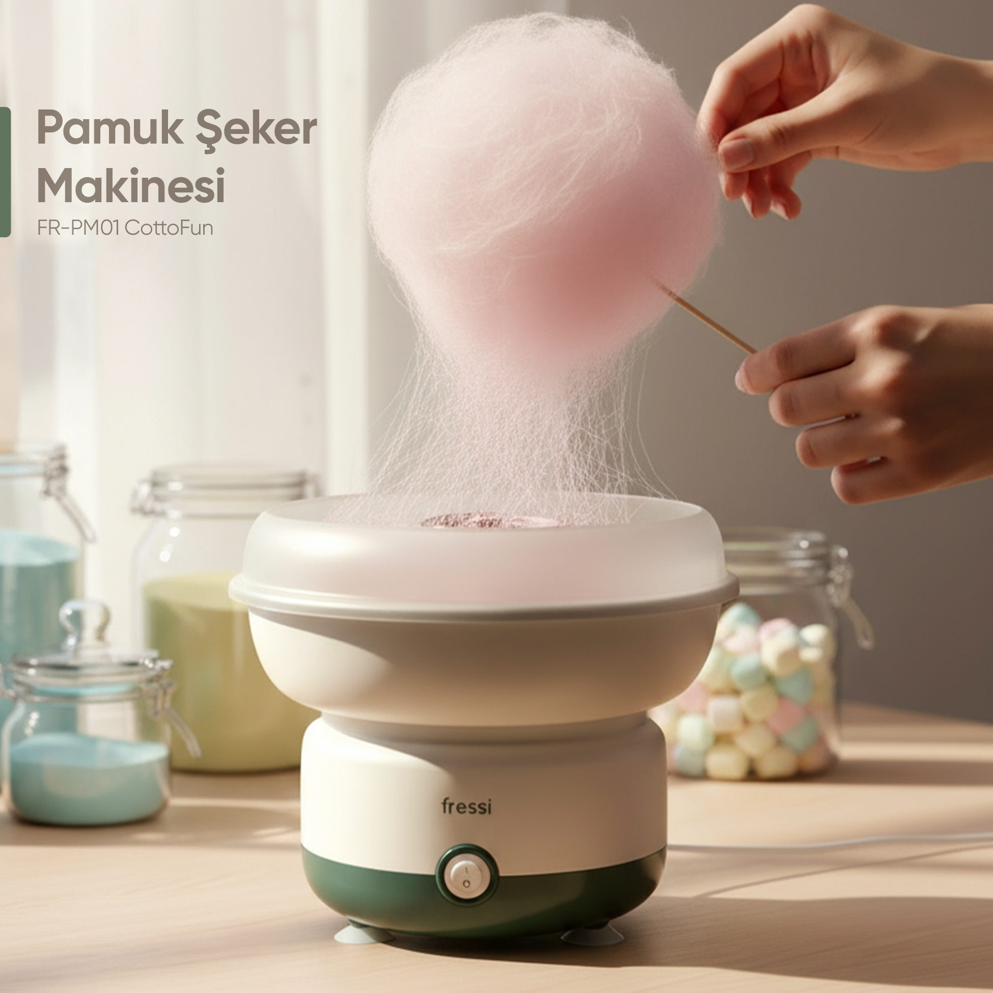 Pembe pamuk şekerinin bir çubuğa sarıldığı pamuk şeker makinesi.