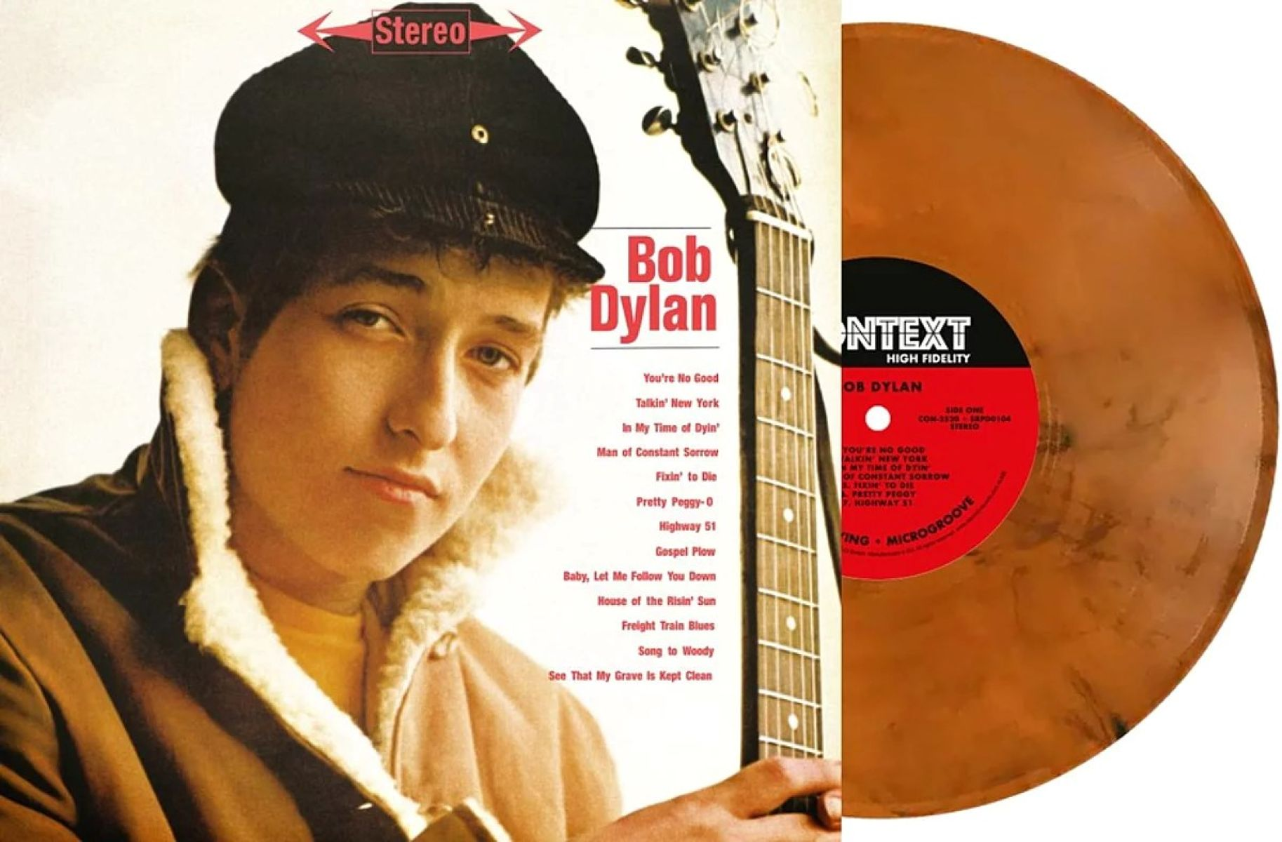Copertina album Bob Dylan con disco in vinile. Bob Dylan indossa berretto e giacca.