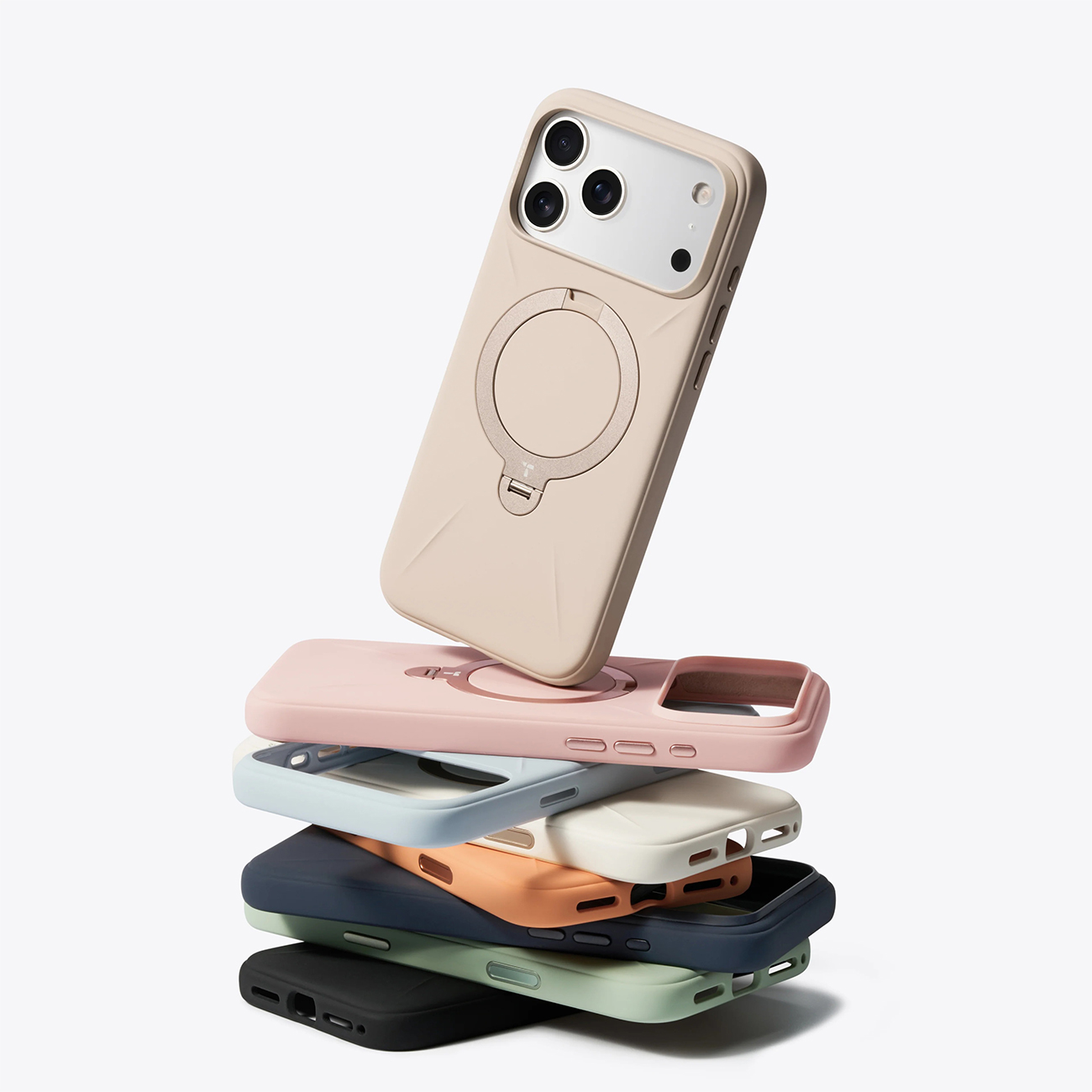 Una pila de fundas de iPhone coloridas en tonos pastel, con una funda encima.