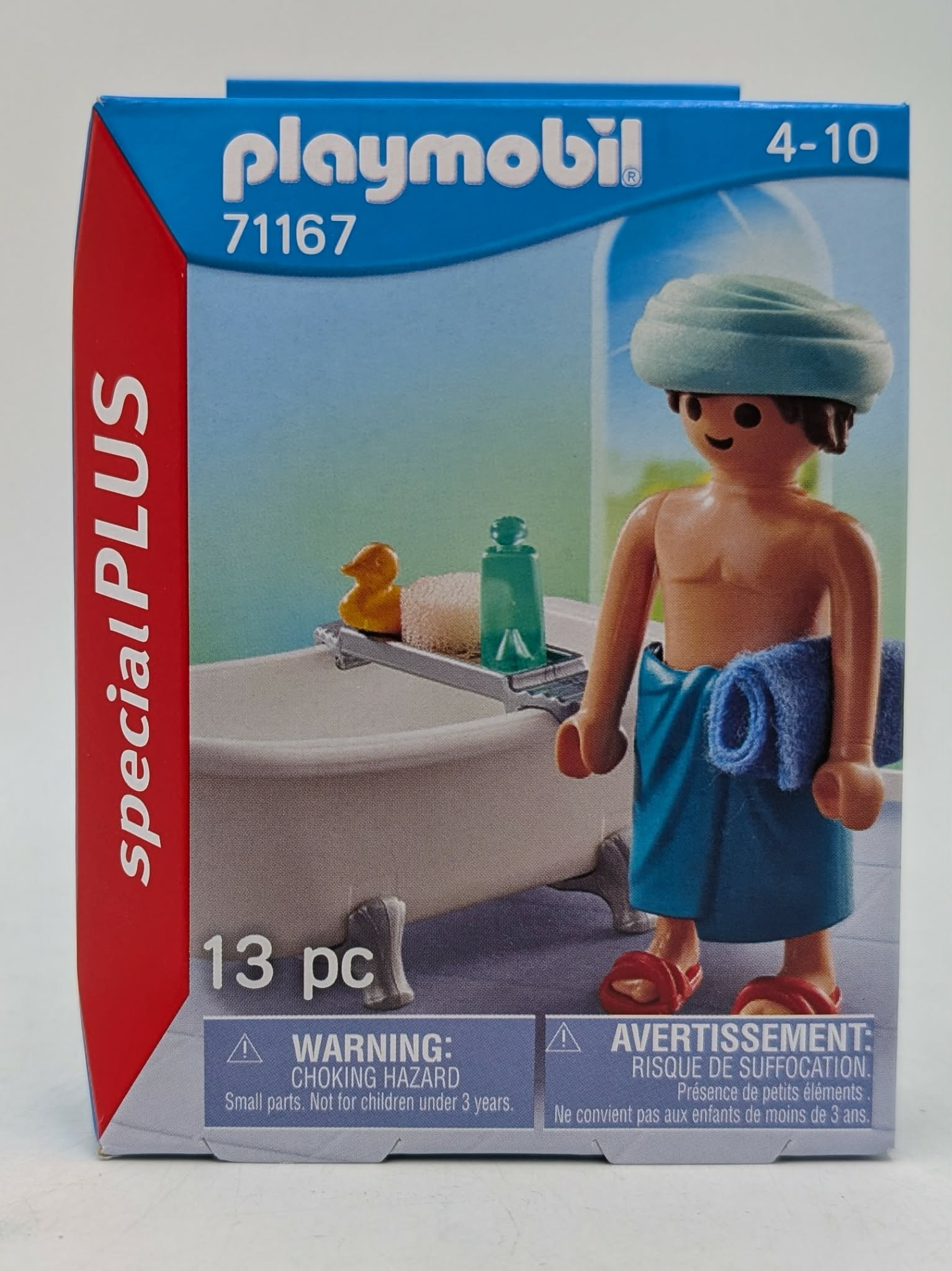 Playmobil-Verpackung mit Figur in Badewanne, Quietscheente und Flasche.