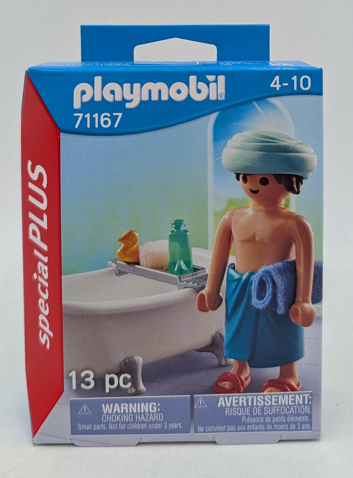 Playmobil-Verpackung mit einer Figur mit Handtuch und Badewanne.