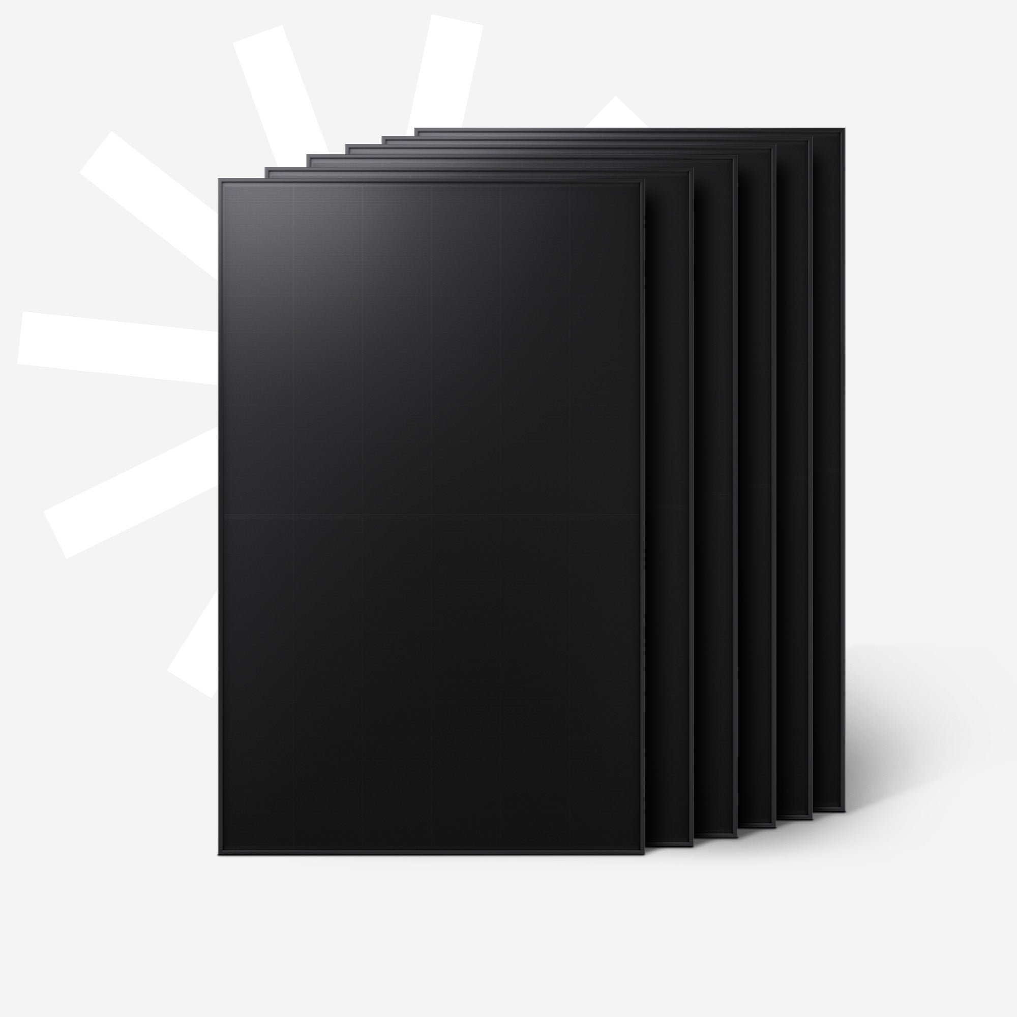 Mehrere schwarze Solarmodule stehen nebeneinander auf grauem Hintergrund.