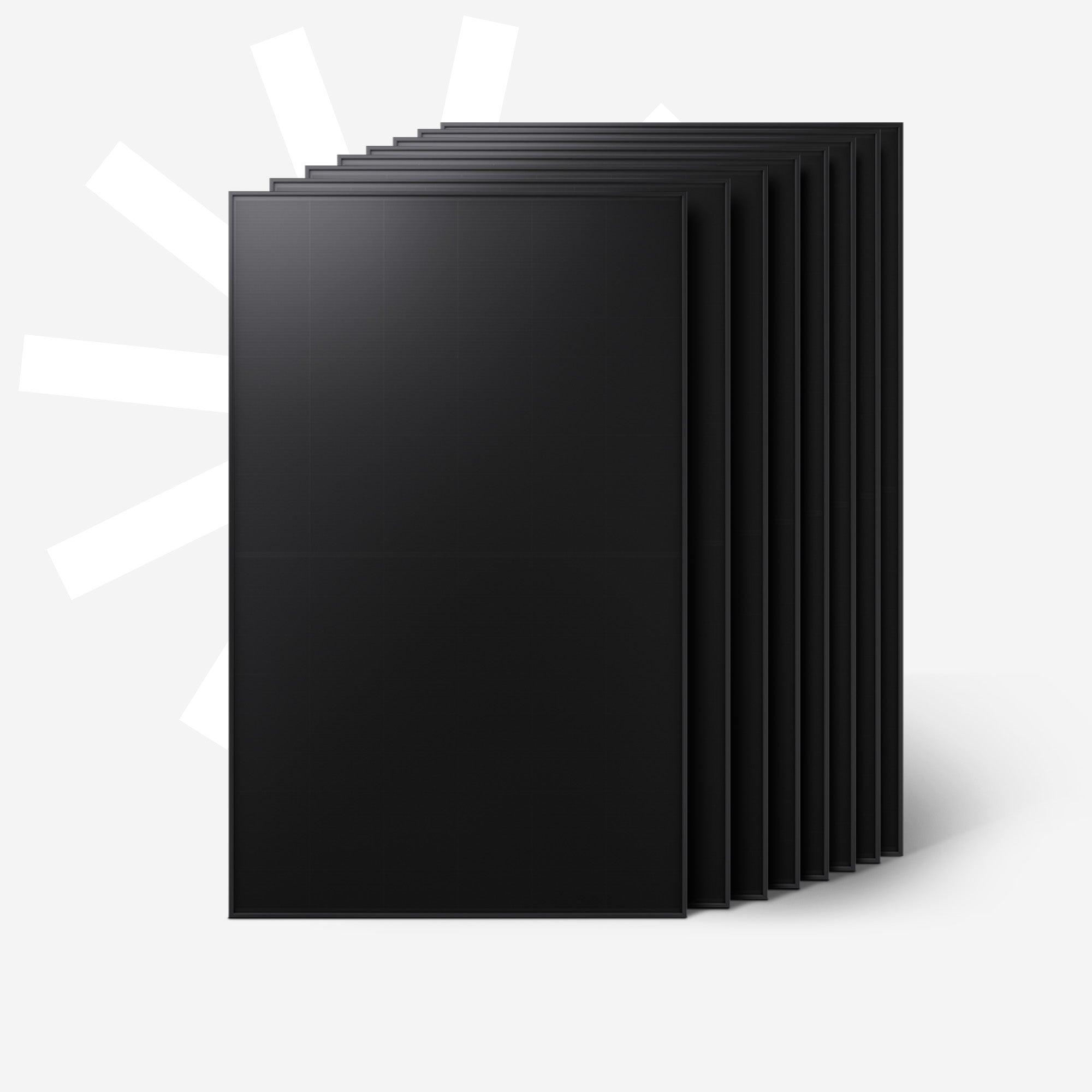 Mehrere schwarze Solarmodule stehen nebeneinander, mit weißem Hintergrund.