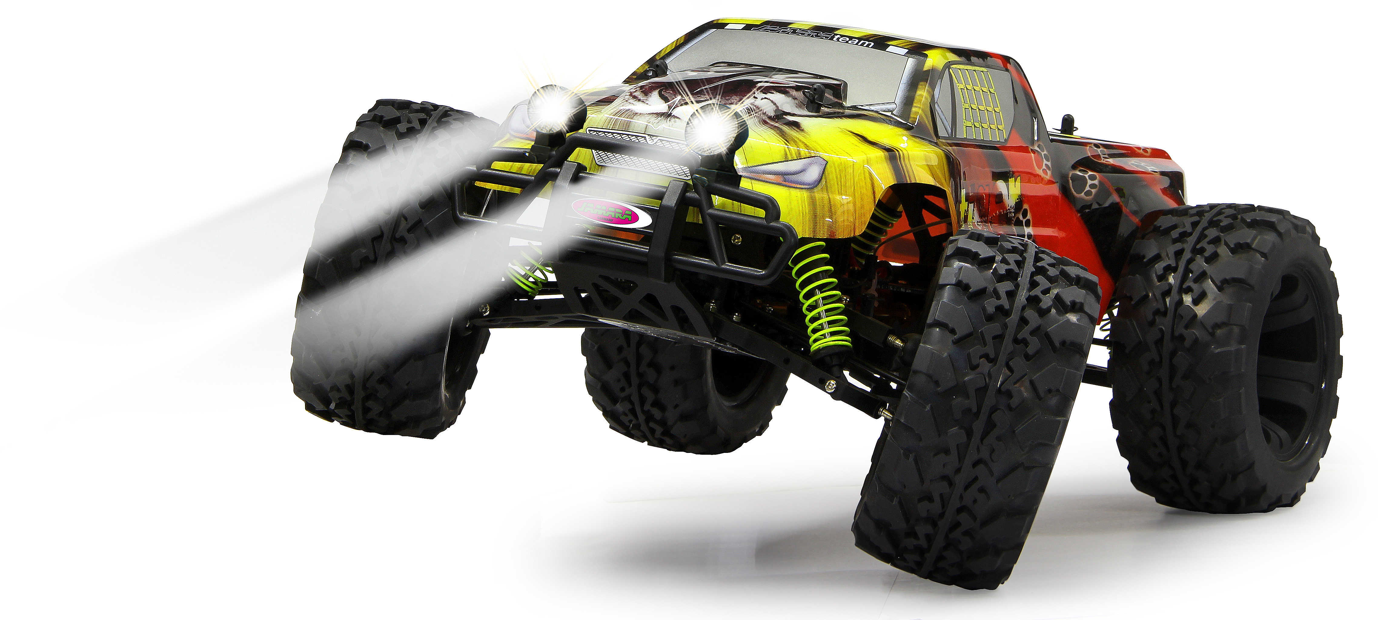 Gelber und roter ferngesteuerter Monstertruck mit leuchtenden Scheinwerfern und Rauch.