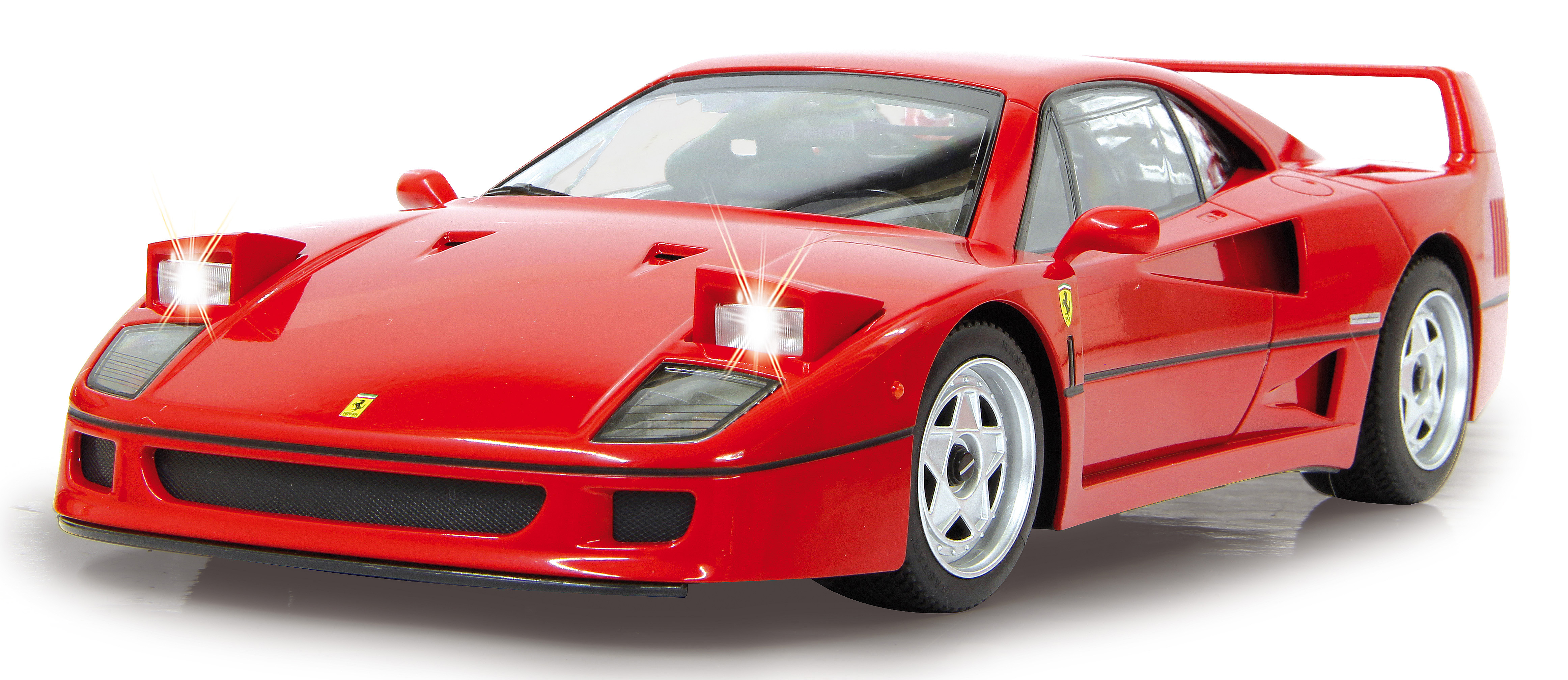 Ein roter Ferrari F40 mit Pop-up-Scheinwerfern und silbernen Felgen.