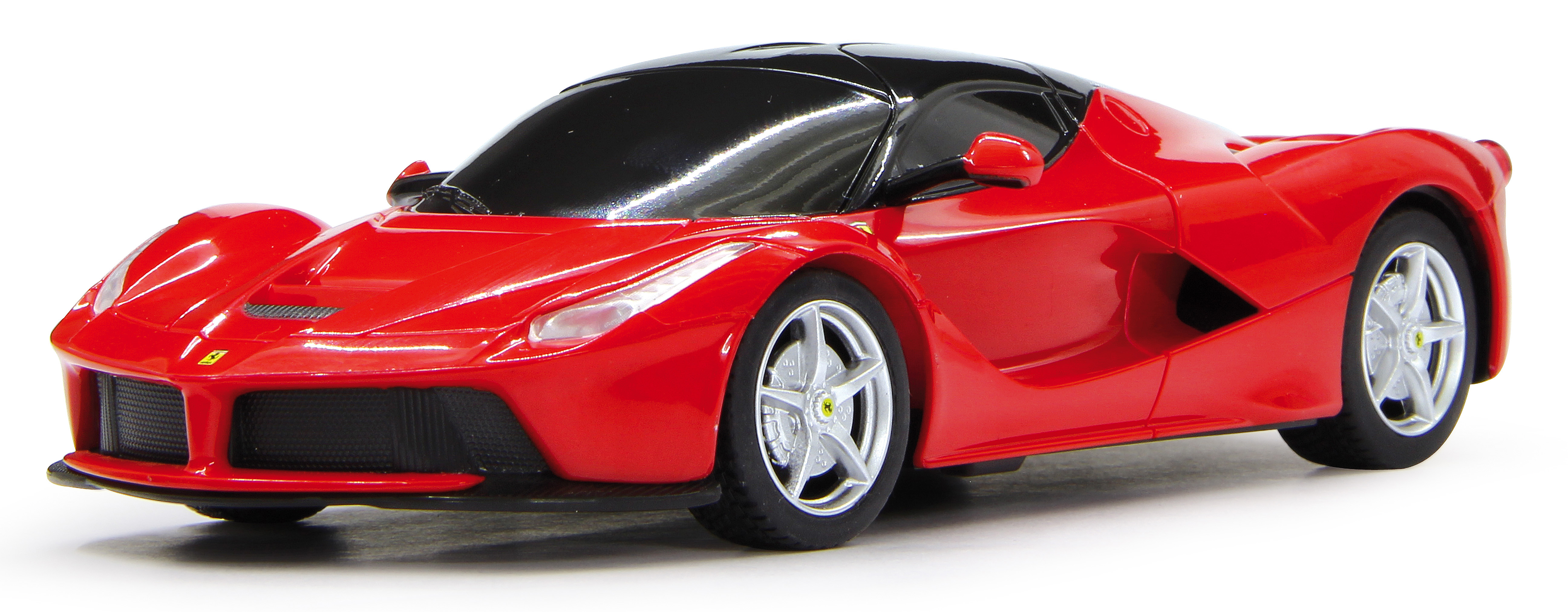Czerwony samochodzik Ferrari z czarnym dachem i srebrnymi kołami na białym tle.