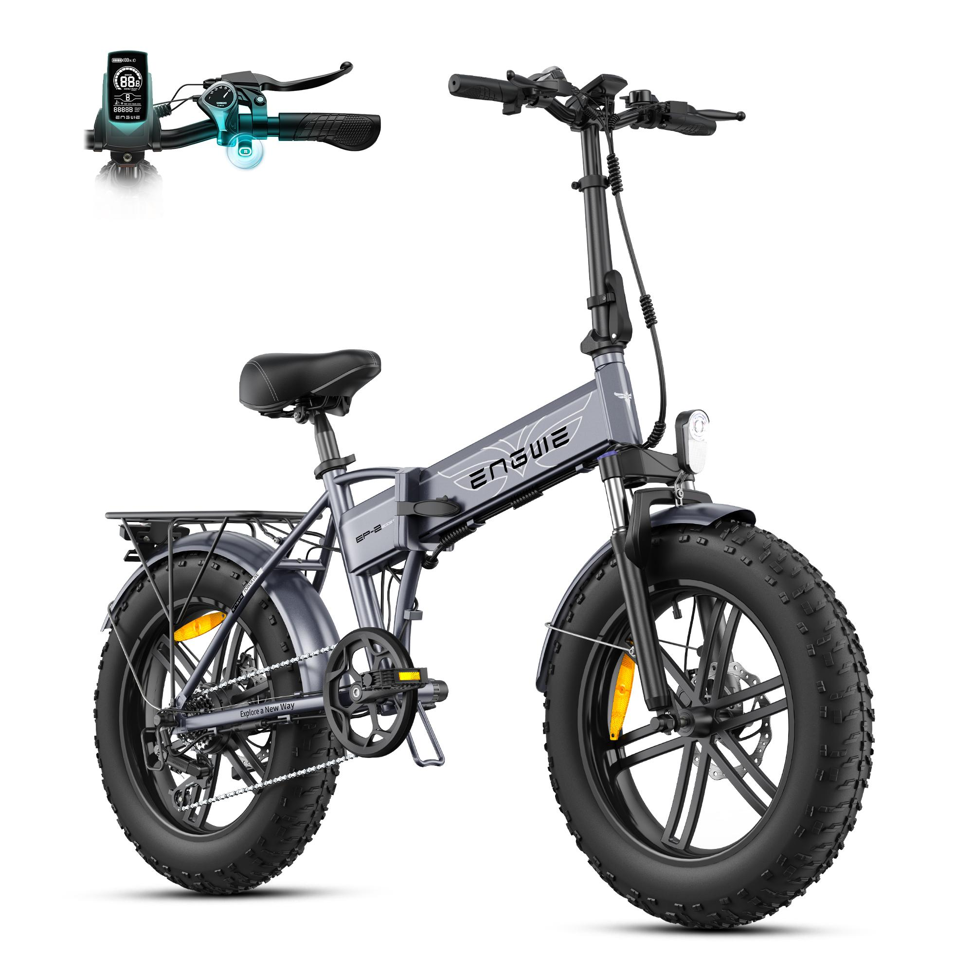 Bicicleta eléctrica plegable gris con neumáticos anchos, portaequipajes, luz y pantalla.