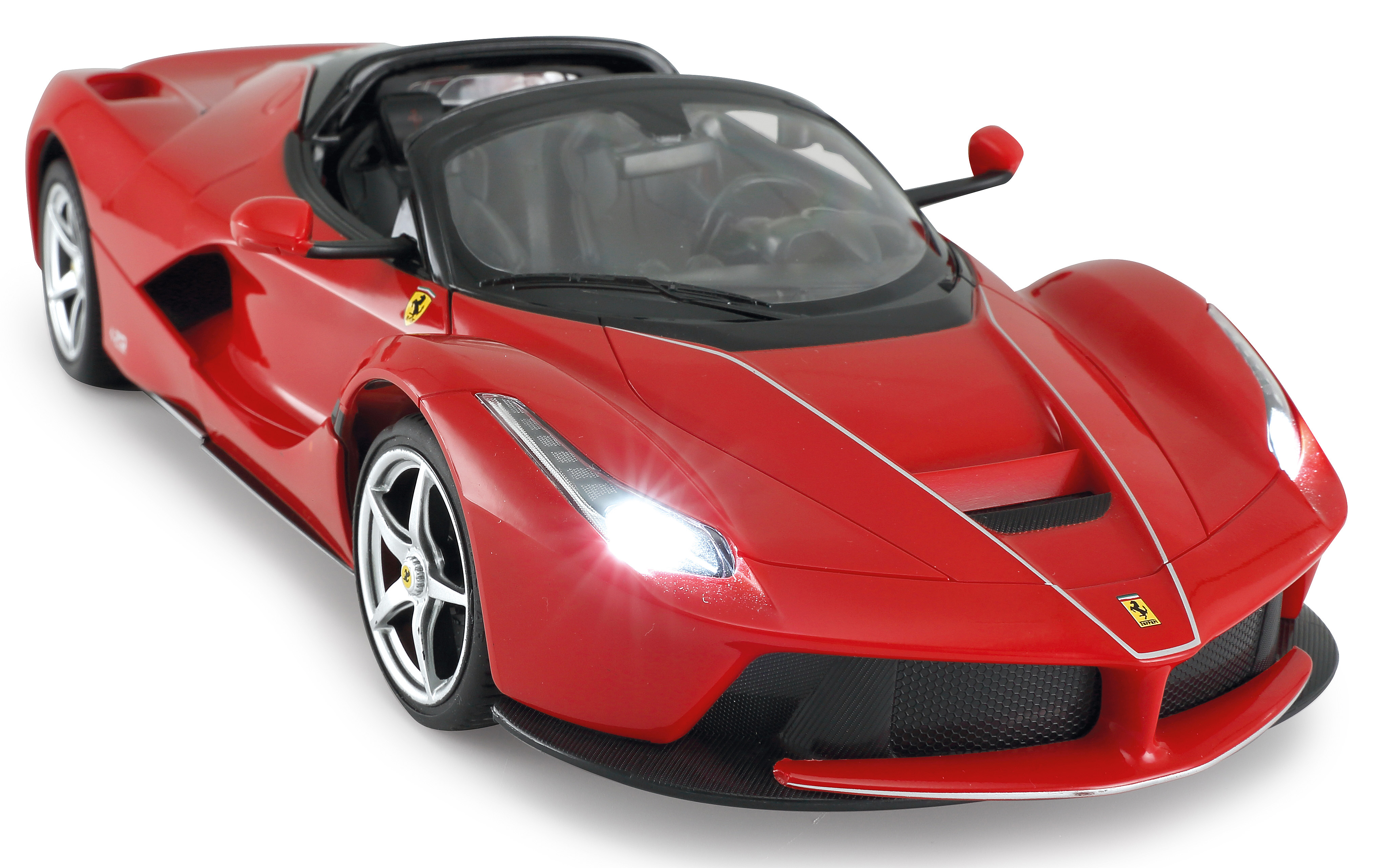 Ein roter Ferrari-Sportwagen mit silbernen Felgen und leuchtenden Scheinwerfern.