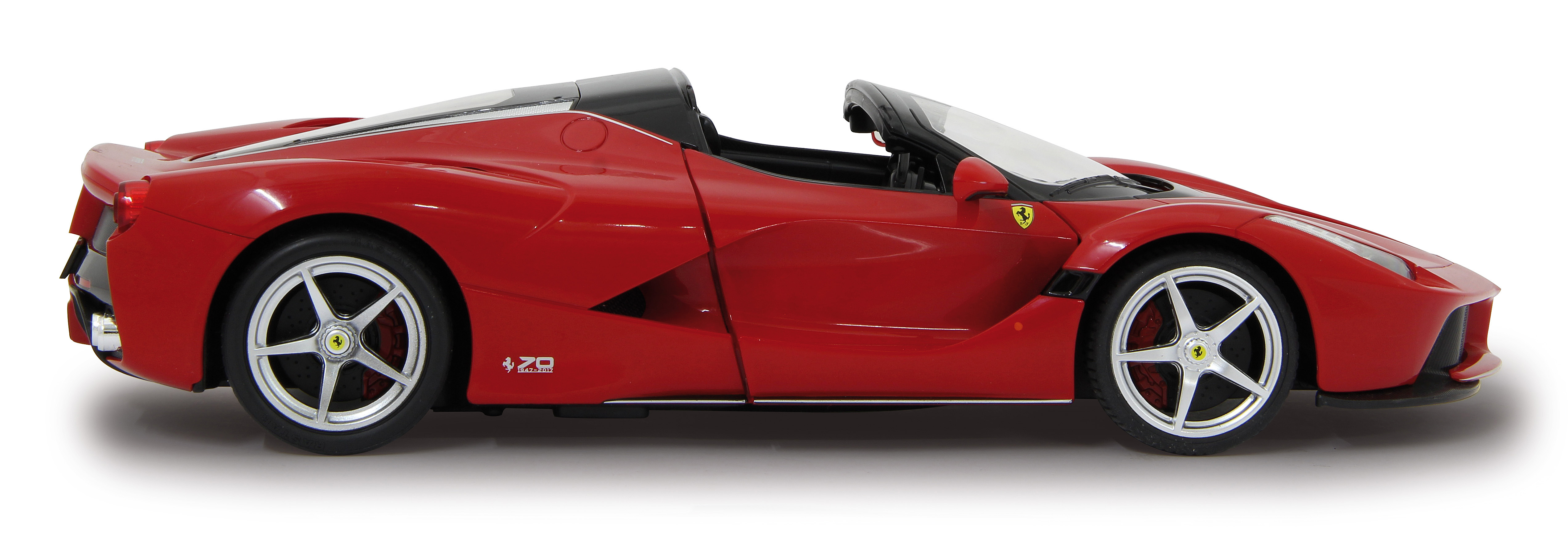 Roter Ferrari-Sportwagen mit offenem Verdeck, seitliche Ansicht. Felgen mit Ferrari-Logo.