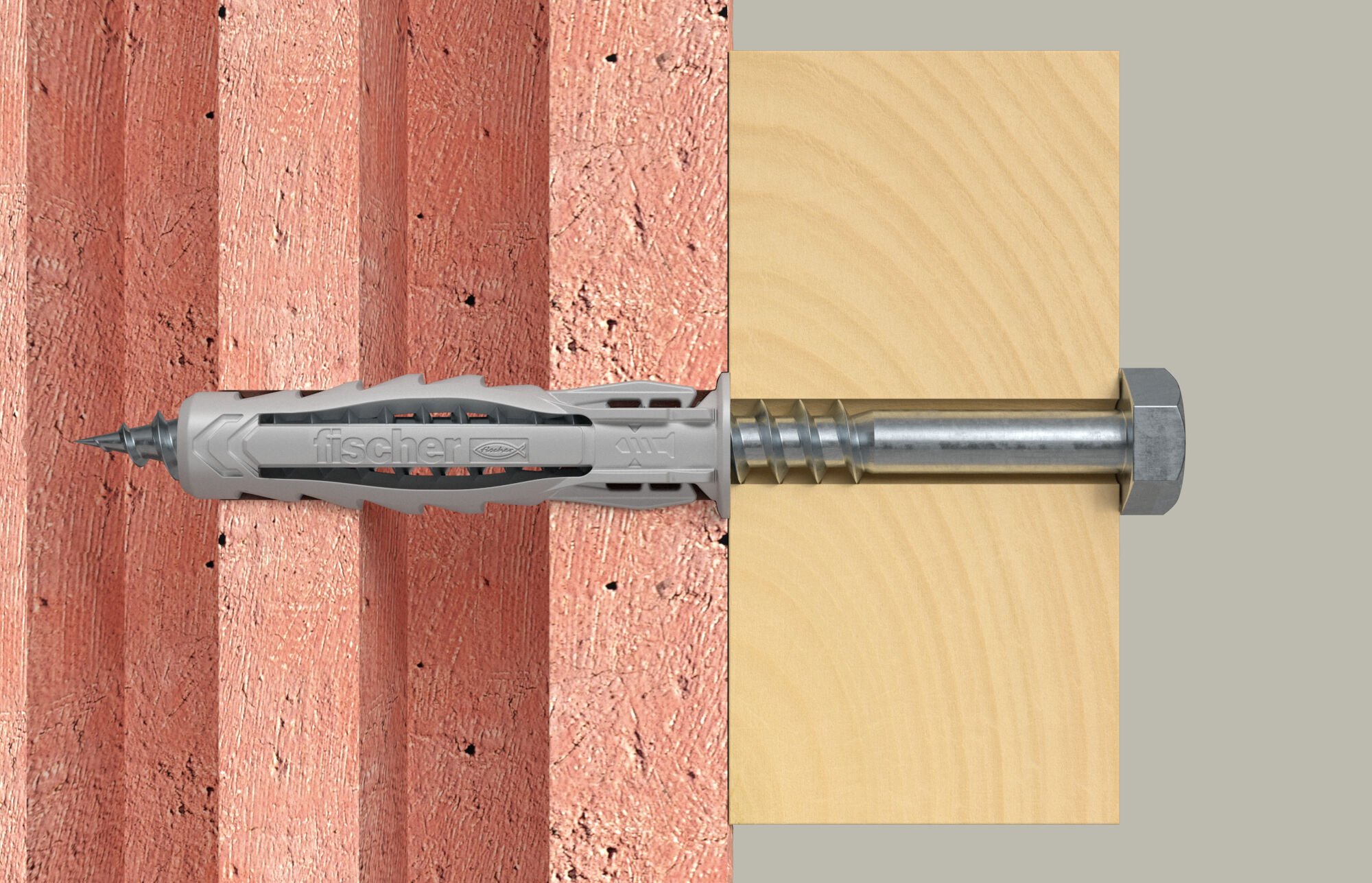 Grauer Dübel mit Schraube in rotem Mauerwerk und Holz.