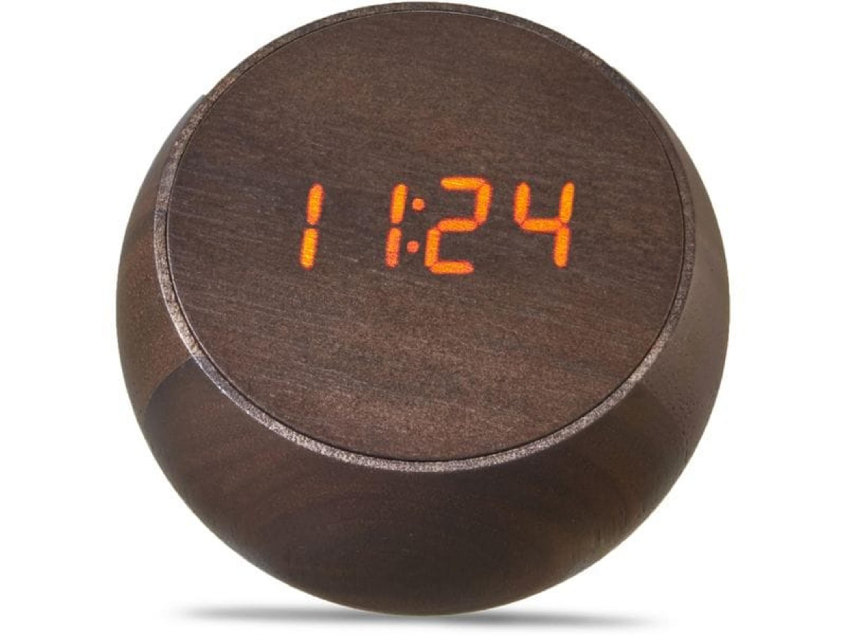 Eine runde, braune Digitaluhr zeigt 11:24 in orangen Ziffern.