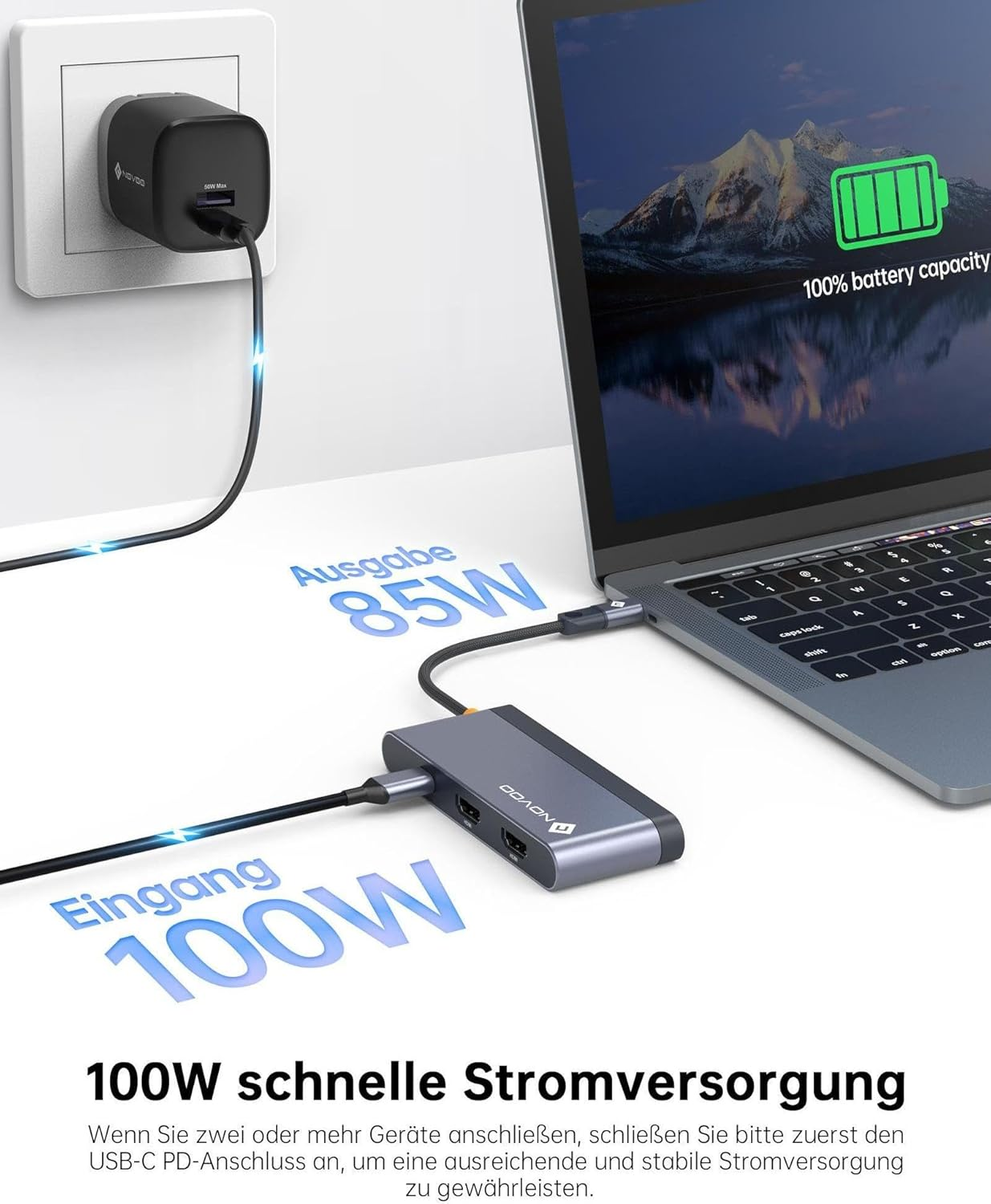Ein Laptop wird über einen USB-C-Hub mit Strom versorgt. Ein Netzteil lädt den Hub.