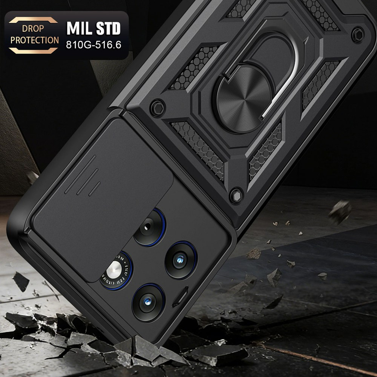 Coque de téléphone noire avec cache-objectif, support bague et certification MIL-STD sur sol craquelé.
