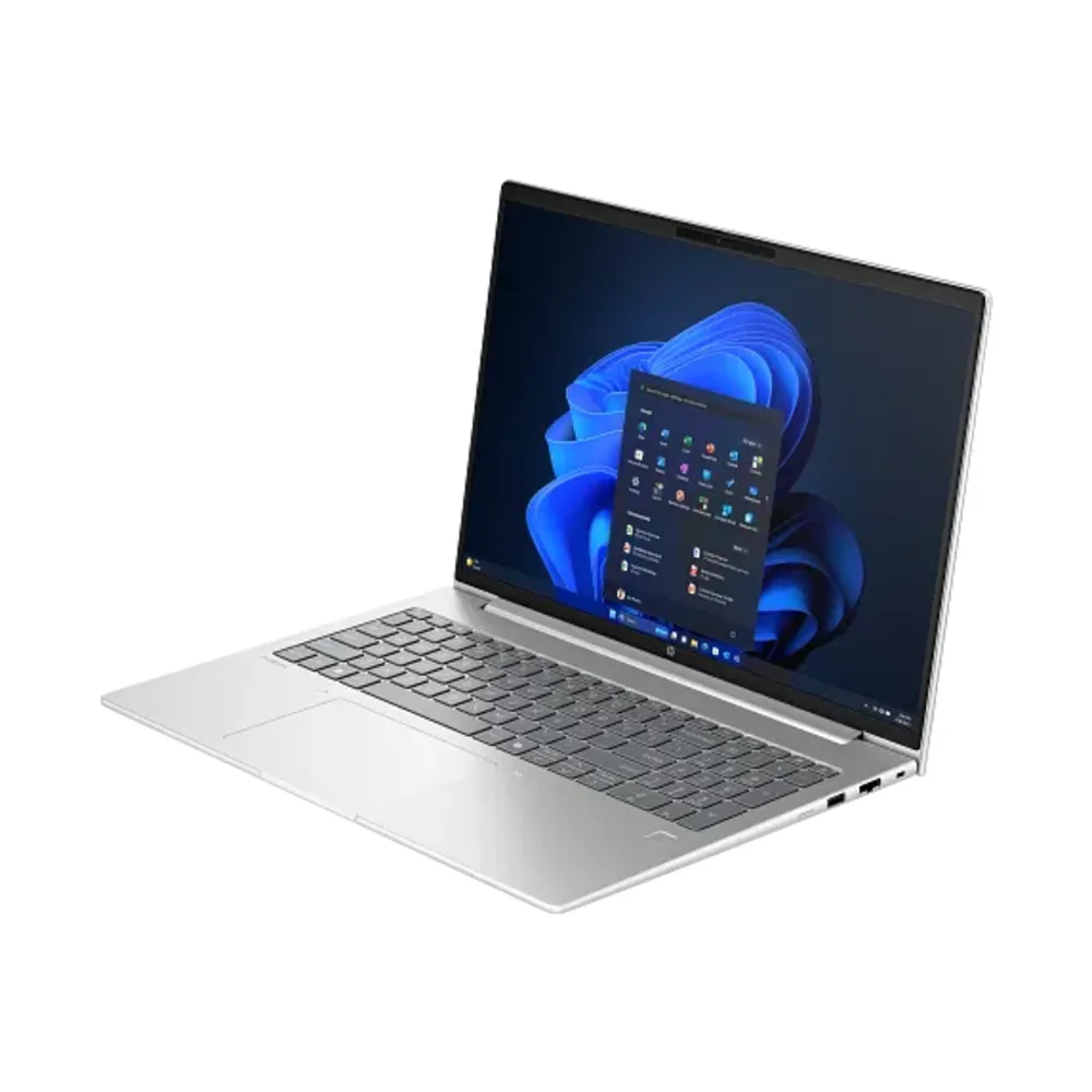 Ekranında mavi Windows 11 duvar kağıdı olan gümüş rengi bir dizüstü bilgisayar.