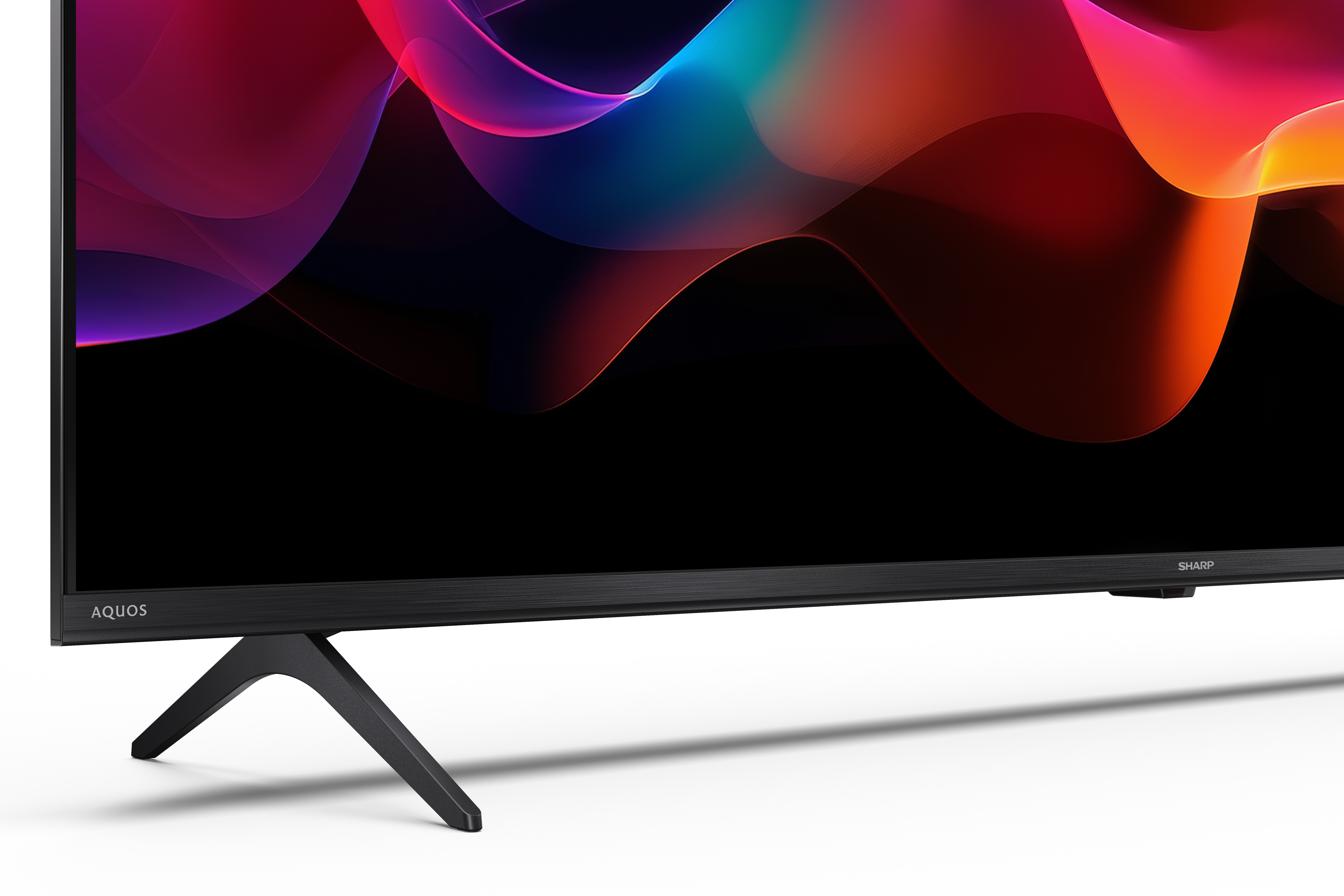 Ein moderner Fernseher mit einem abstrakten, bunten Hintergrund auf dem Bildschirm.
