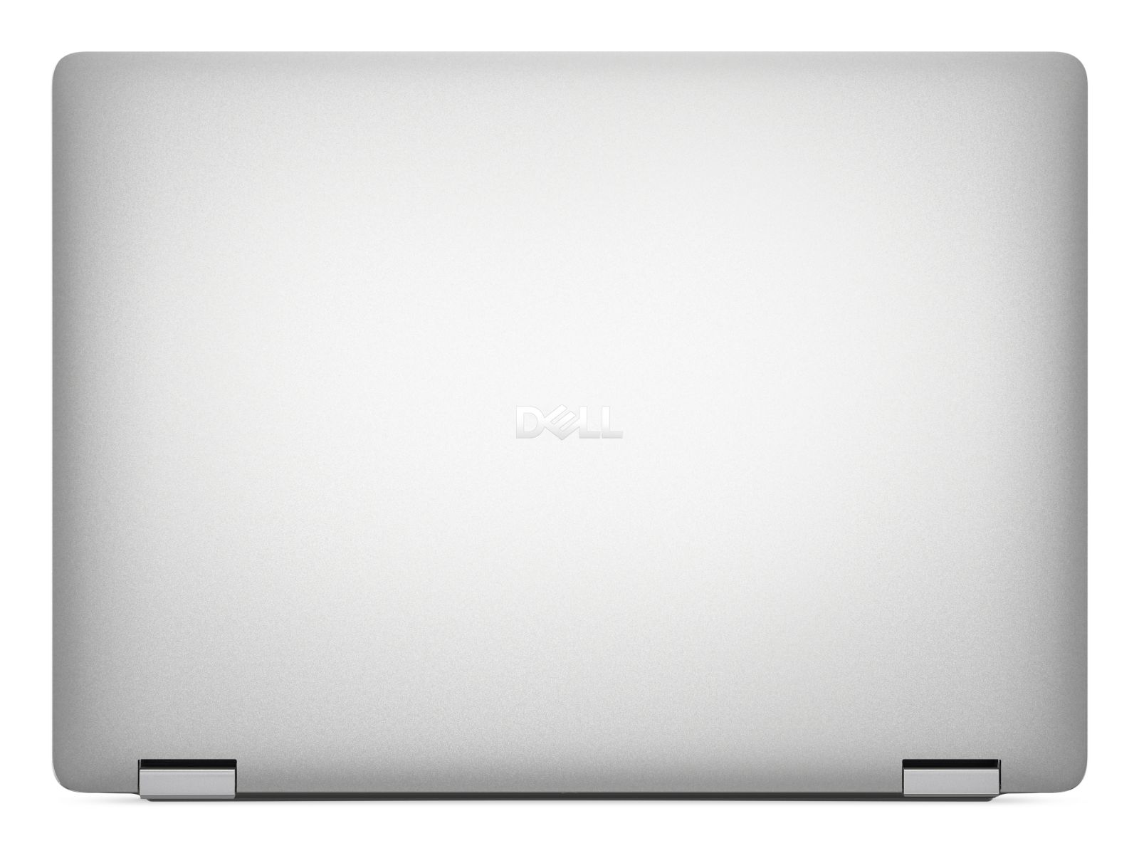 Zamknięty srebrny laptop Dell z logo Dell na środku.