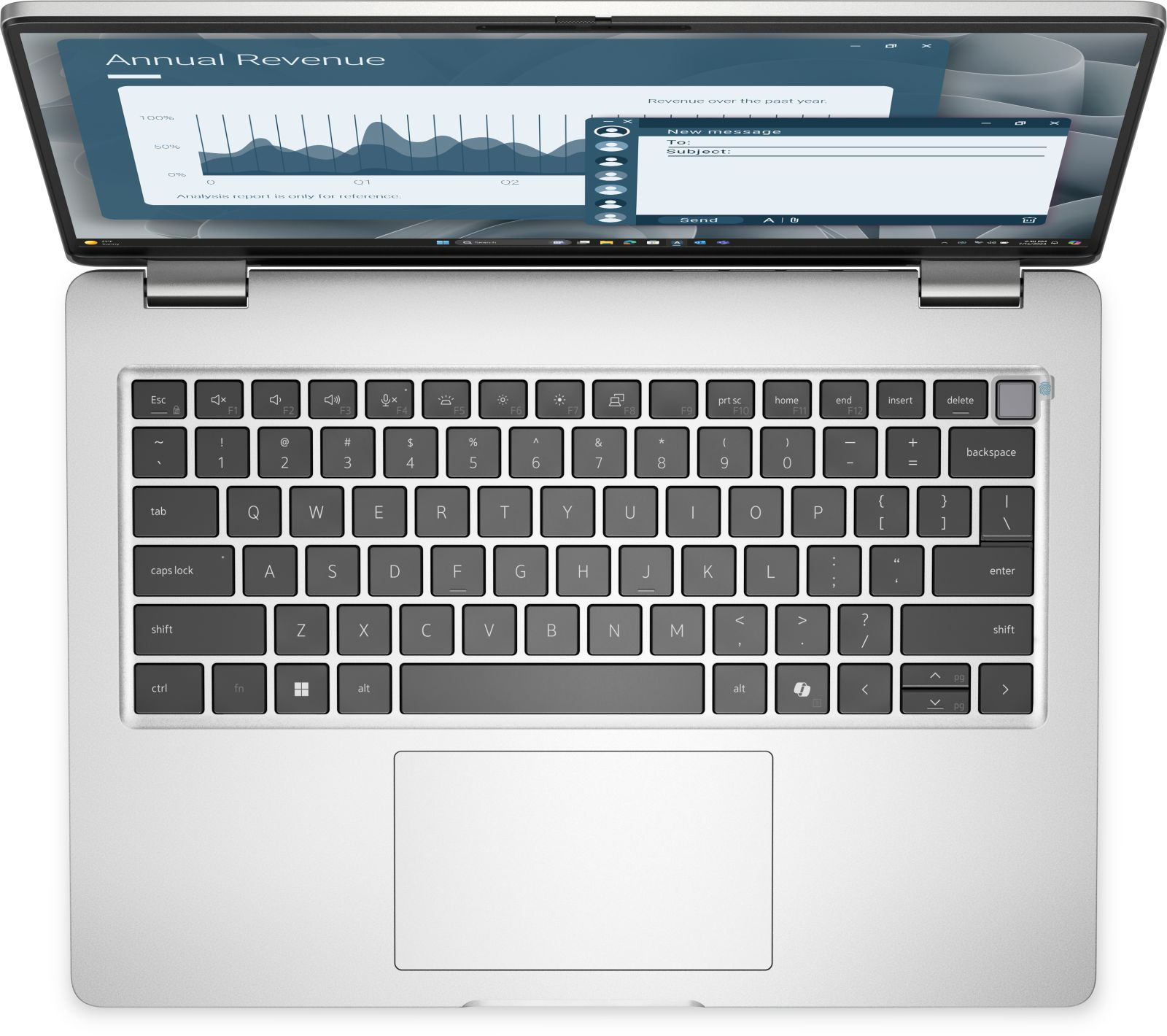 Ein geöffneter Laptop zeigt einen jährlichen Umsatzbericht und eine neue E-Mail-Nachricht.