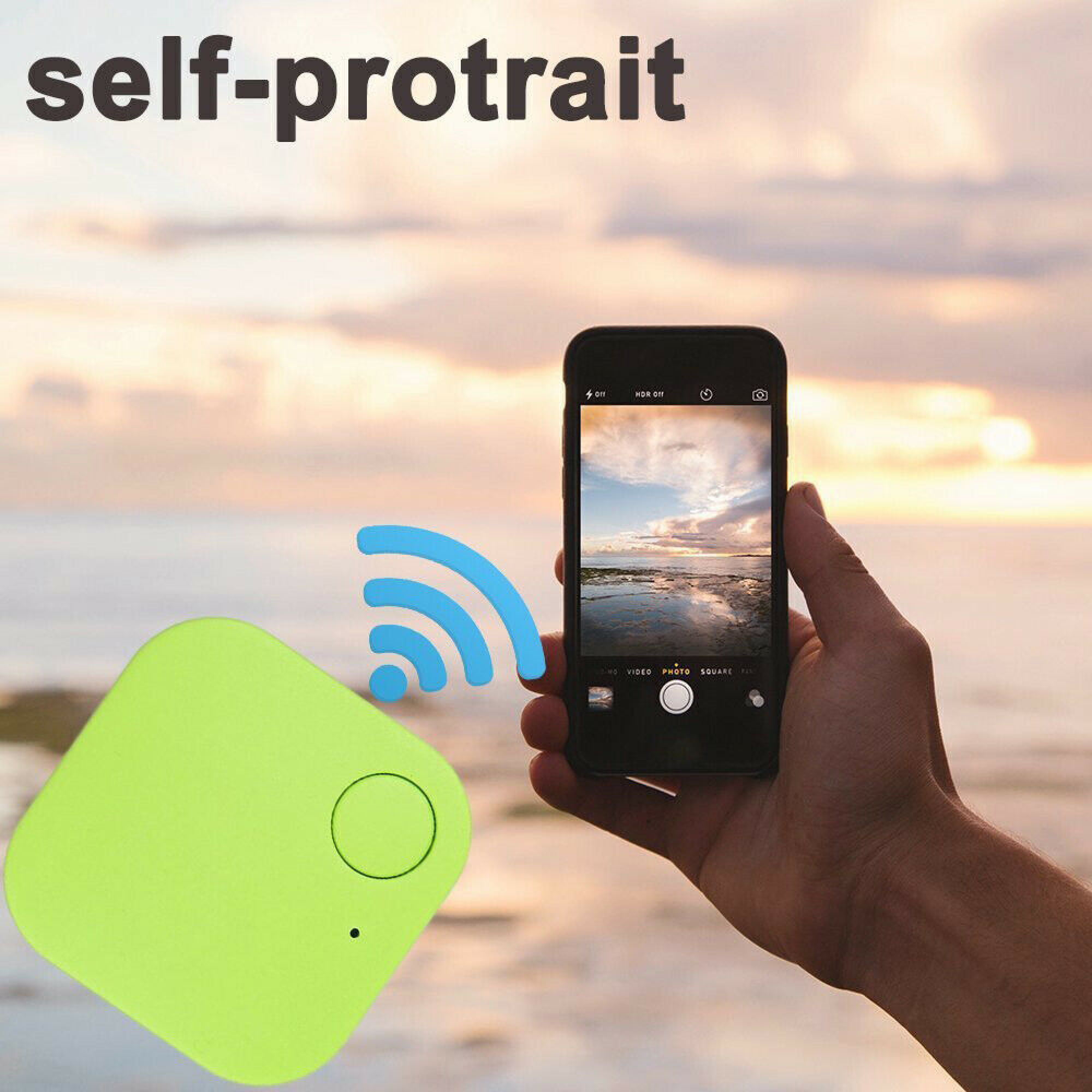 Ein grüner Tracker liegt neben einem Handy, das ein Foto am Strand macht.