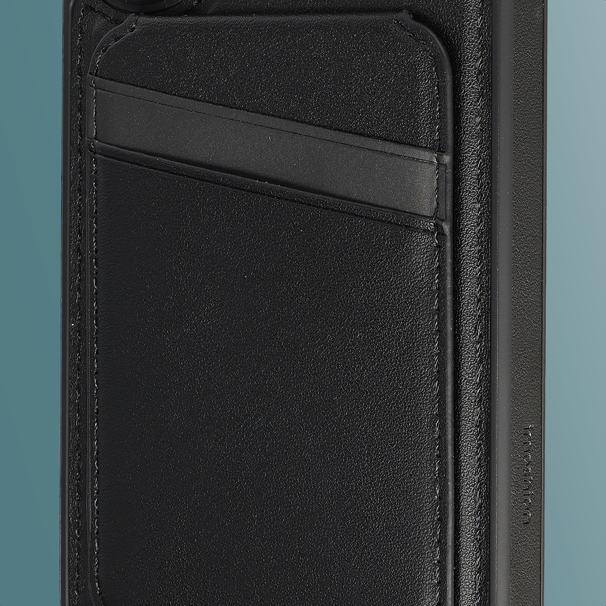 Black leather case with two card slots and stitching.