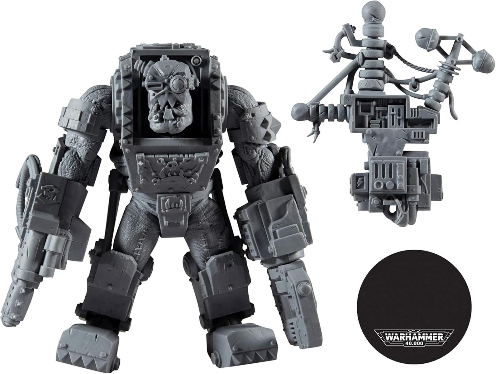 Graue Kunststoffminiatur eines Orks mit Waffen und Ausrüstung, mit Warhammer 40.000-Logo.
