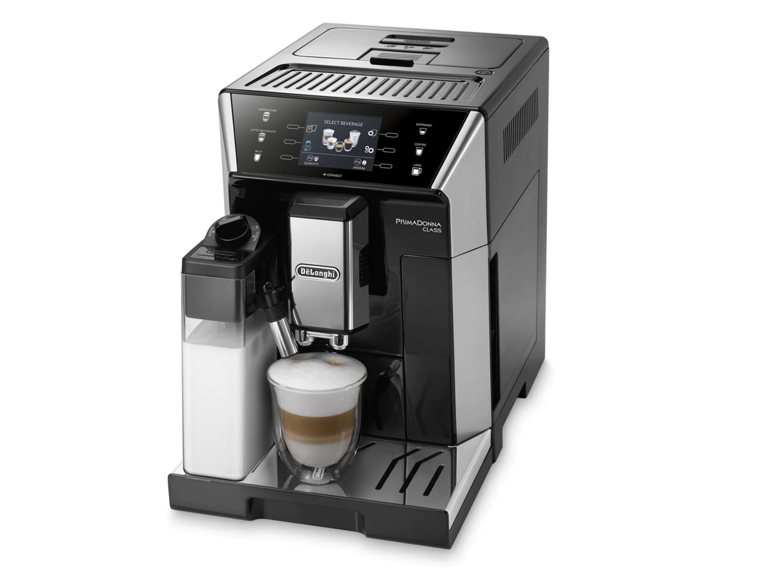 Una cafetera DeLonghi negra con jarra de leche y una bebida preparada.
