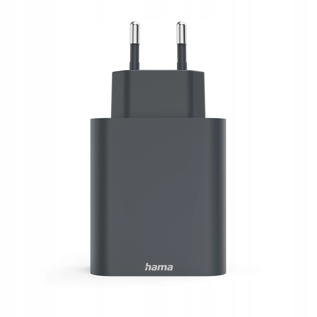 Szary adapter wtyczki Hama z dwoma srebrnymi bolcami, stojący na białym tle.