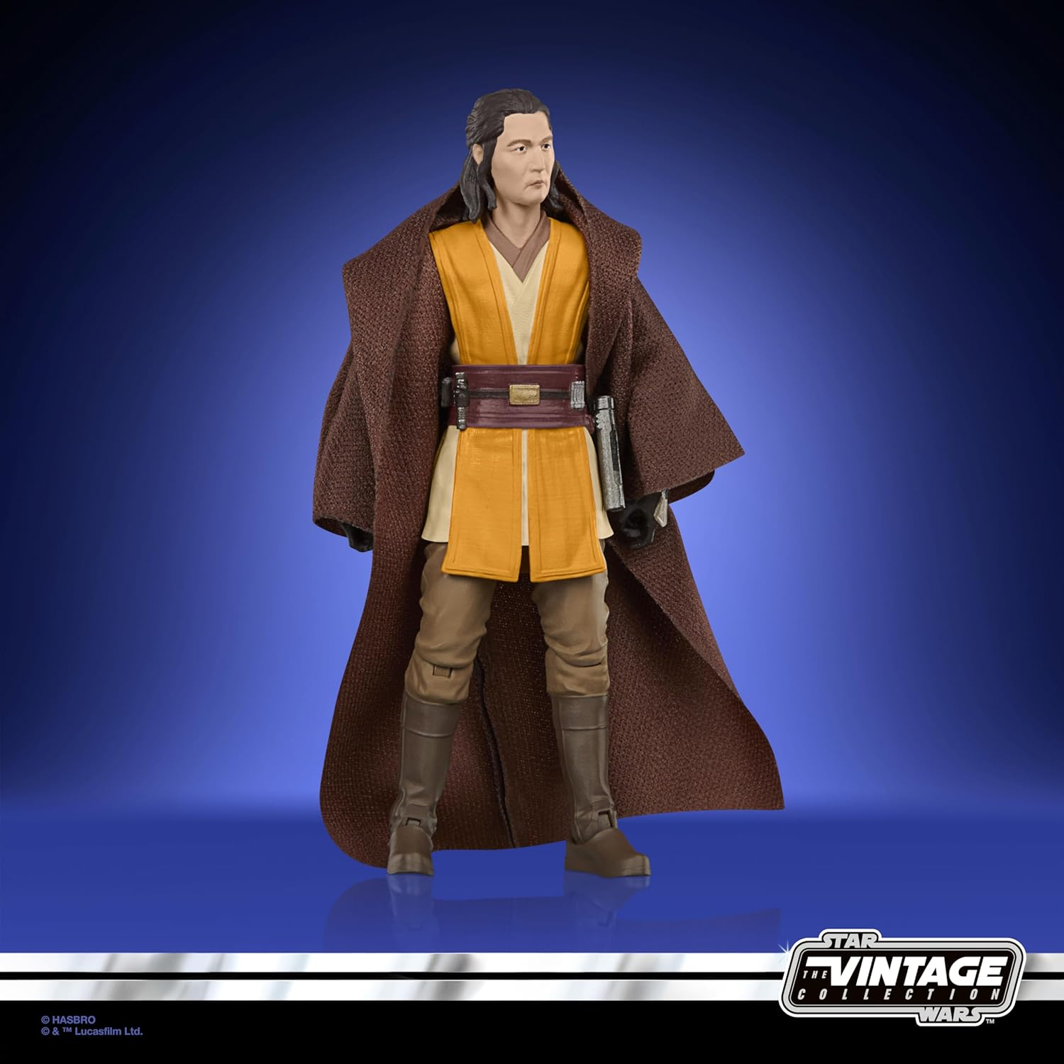 Eine Star Wars Vintage Collection Figur eines Mannes mit braunem Umhang und gelber Tunika.