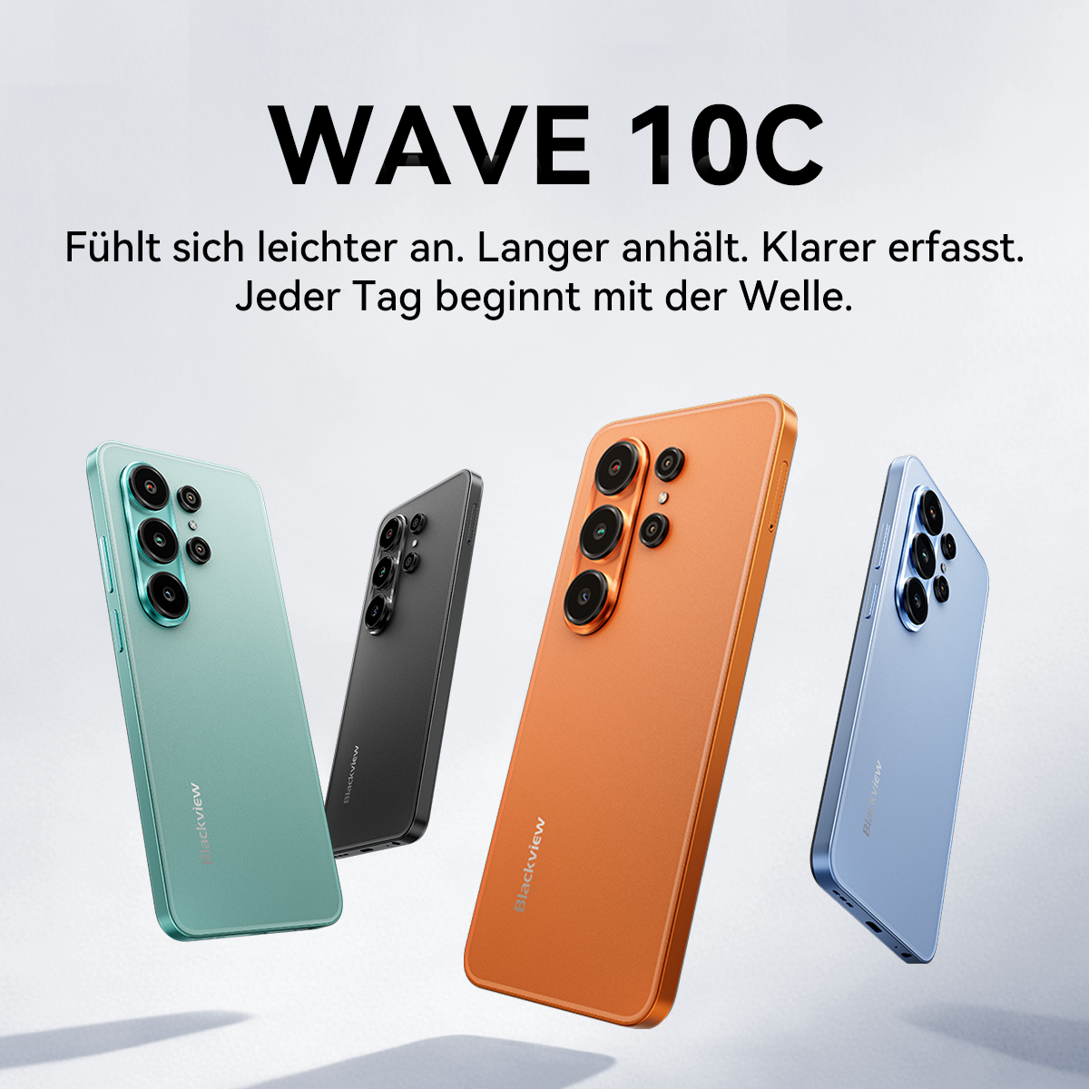 Vier Handys in Mintgrün, Schwarz, Orange und Blau, mit Kameras auf der Rückseite.