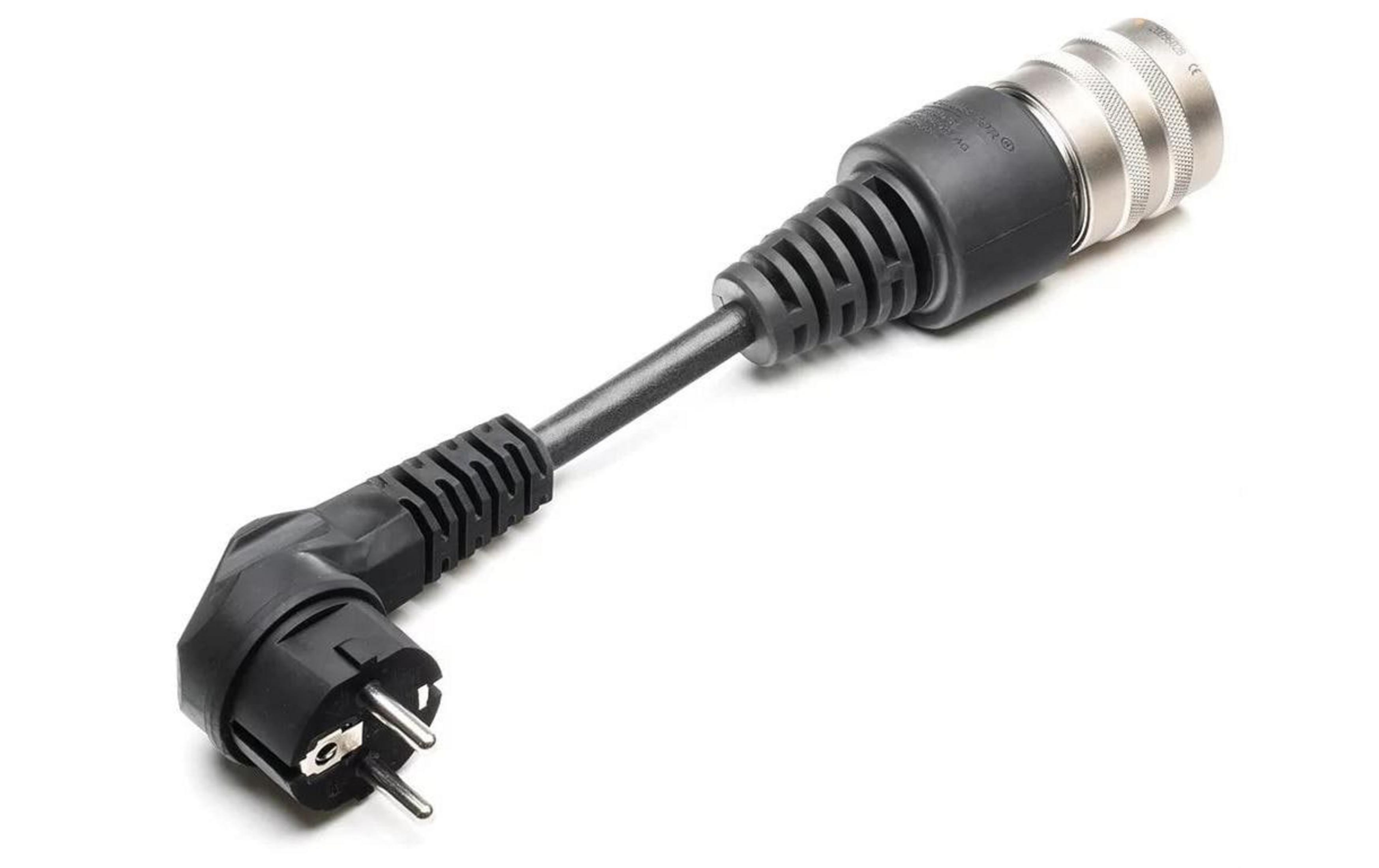 Un adaptateur noir avec une prise européenne et un connecteur argenté.