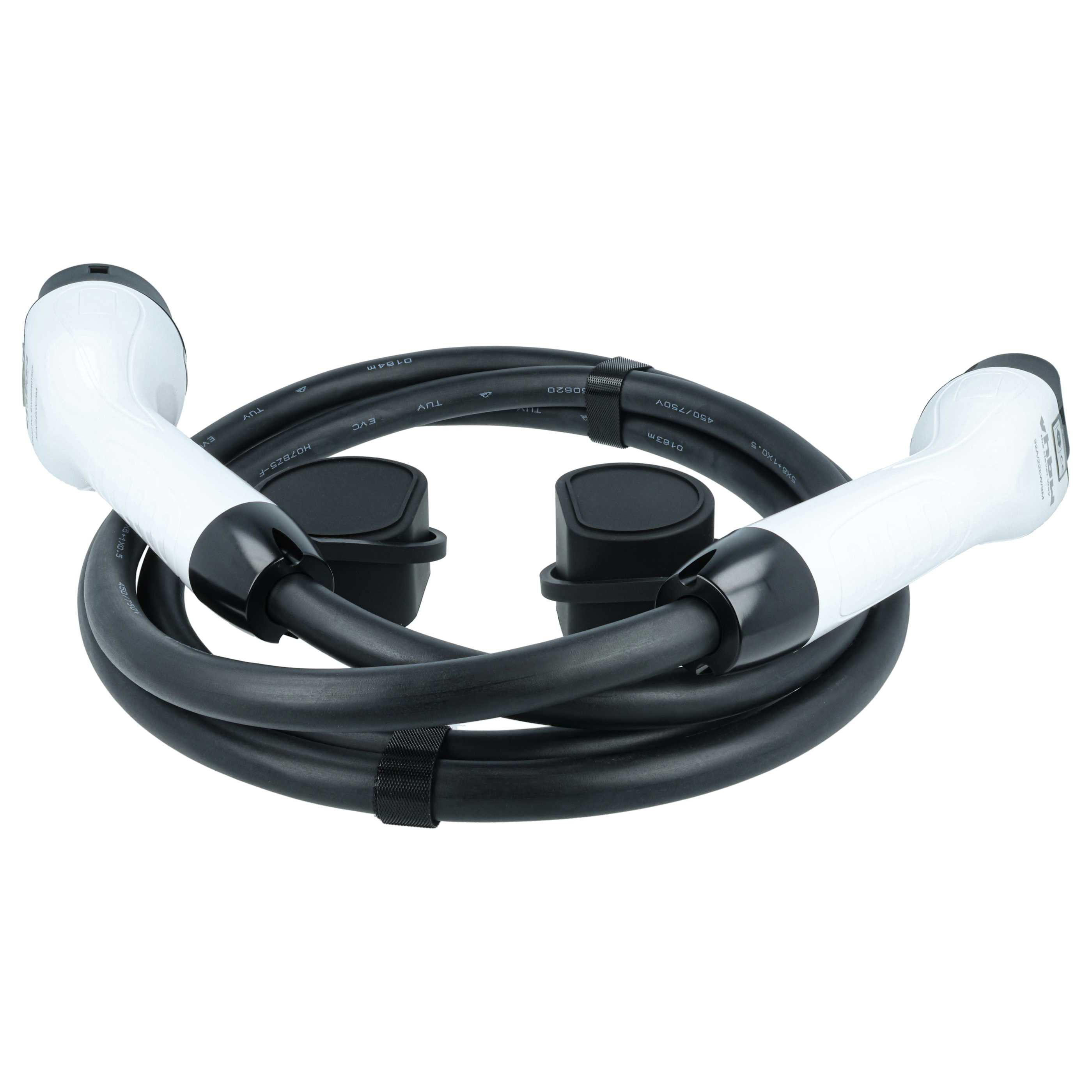 Ein schwarzes Kabel mit zwei weißen Steckern, aufgerollt.