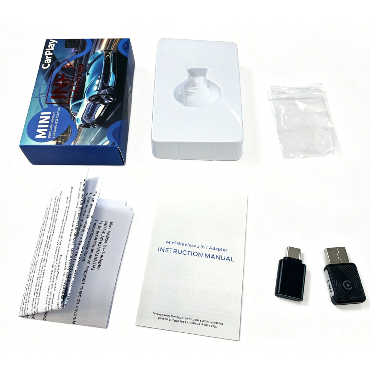 Zawartość pudełka adaptera Mini Wireless 2 w 1: pudełko, wkładka, instrukcje i adaptery.