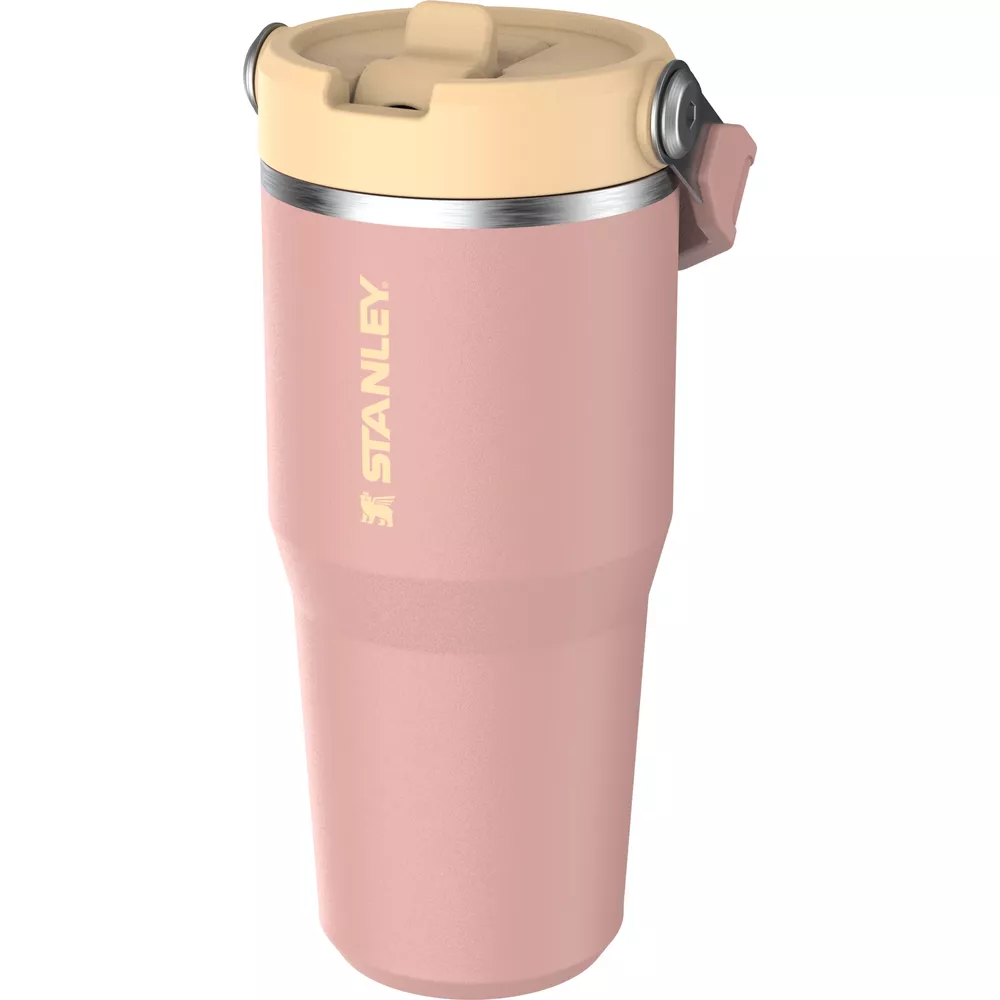 Bej rengi kapaklı ve gümüş detaylı pembe Stanley bardak.