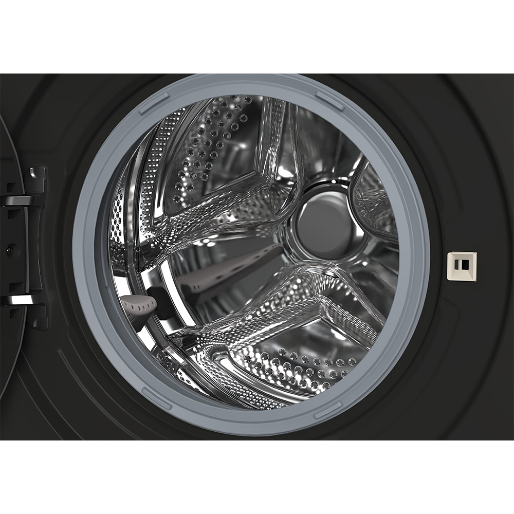 Interior of a washing machine with a shiny drum and a gray seal.