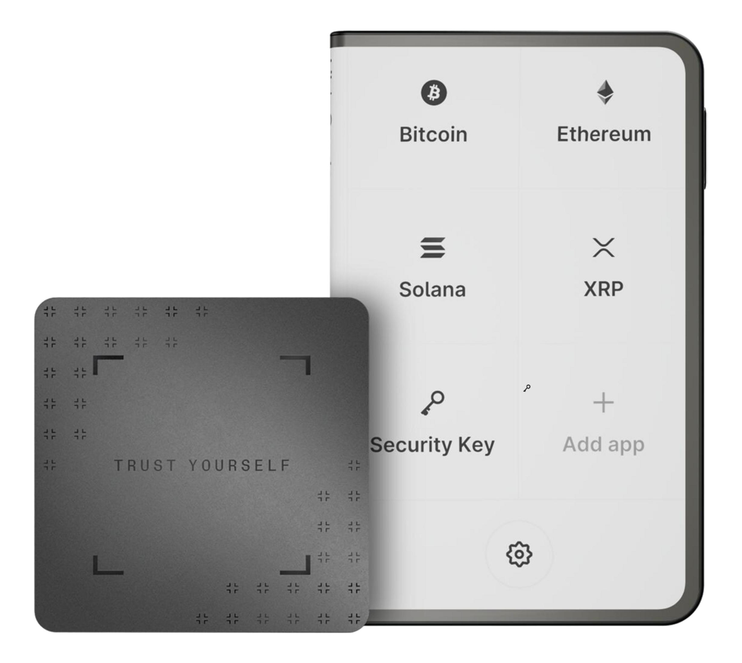 Un smartphone affiche des cryptomonnaies, à côté d'une carte grise avec 
