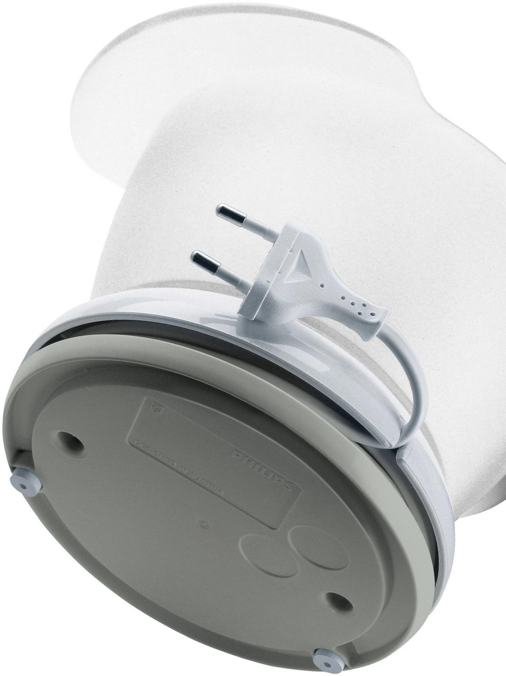 A white plug with a cable attached to a gray and white device.
