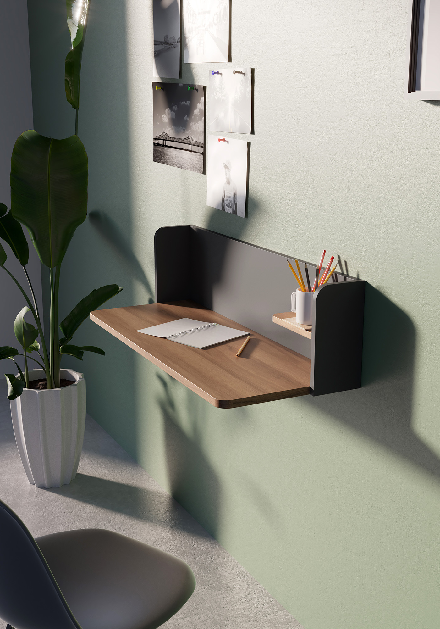 Un escritorio de pared con libreta, lápiz y bolígrafos. Una planta a la izquierda.