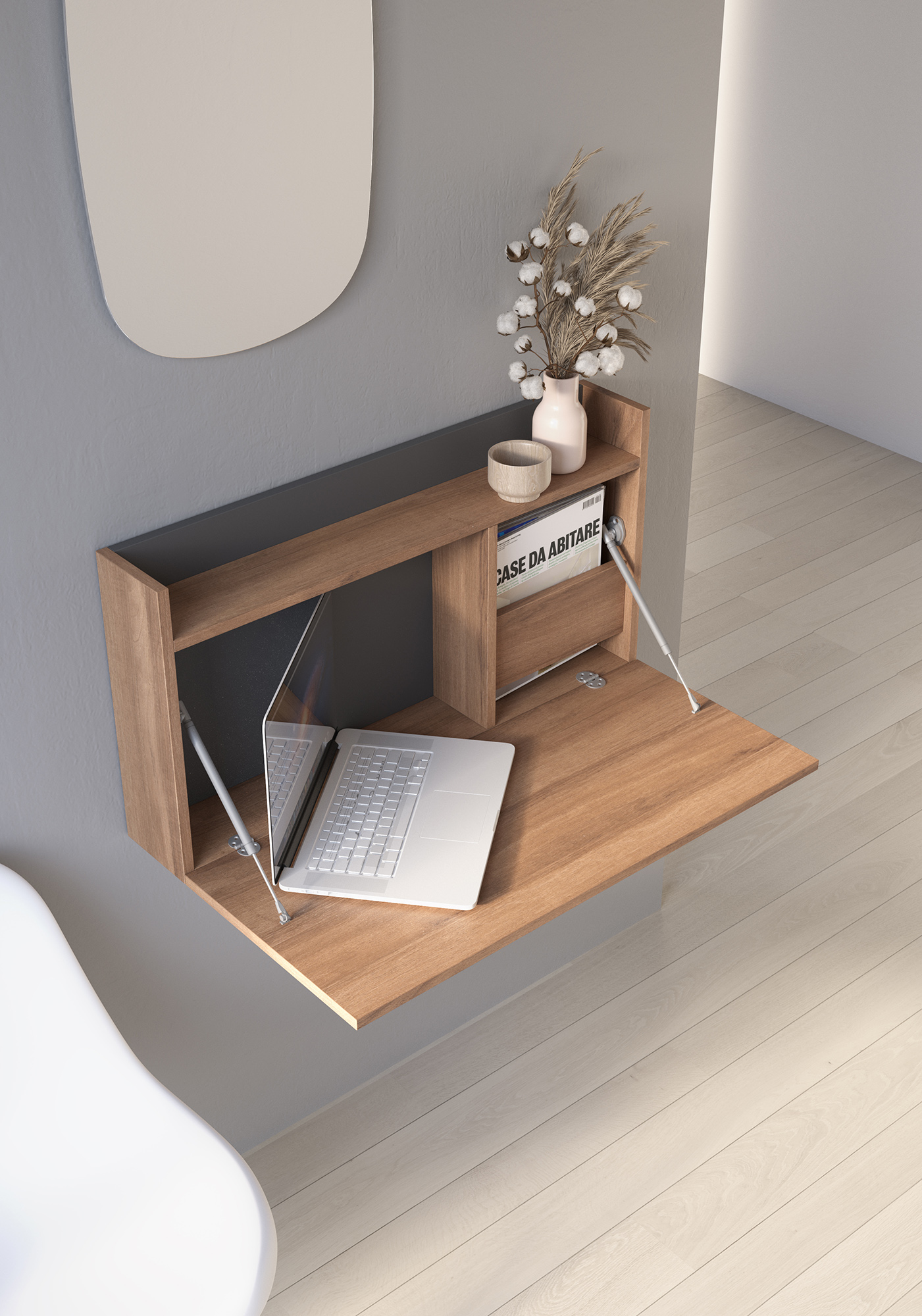 Un escritorio de pared de madera con tapa abierta, portátil, jarrón de algodón y libro.